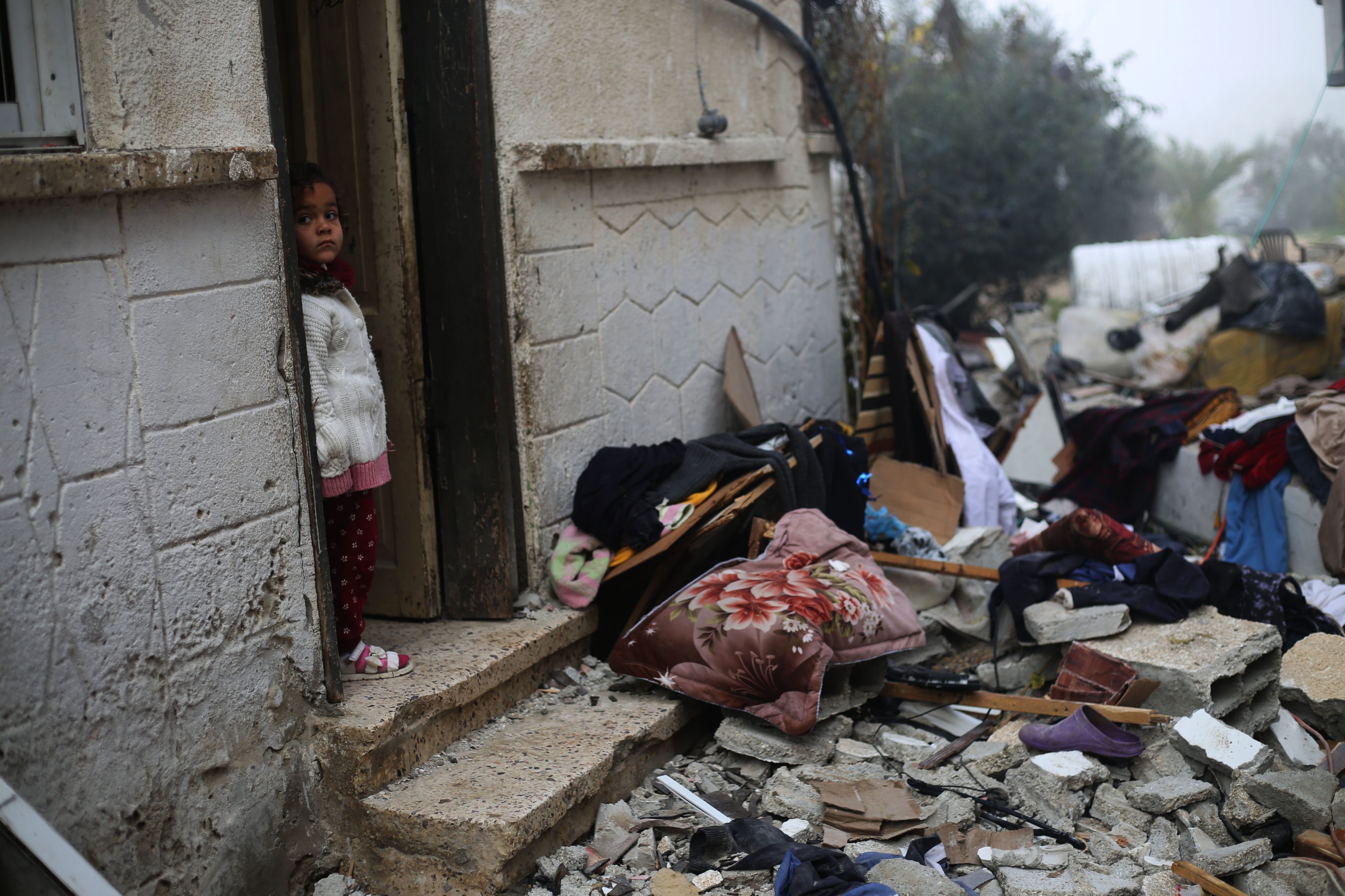 A girl stands near rubble on Friday after an Israeli airstrike in the southern Gaza Strip city of Rafah. Photo: Xinhua