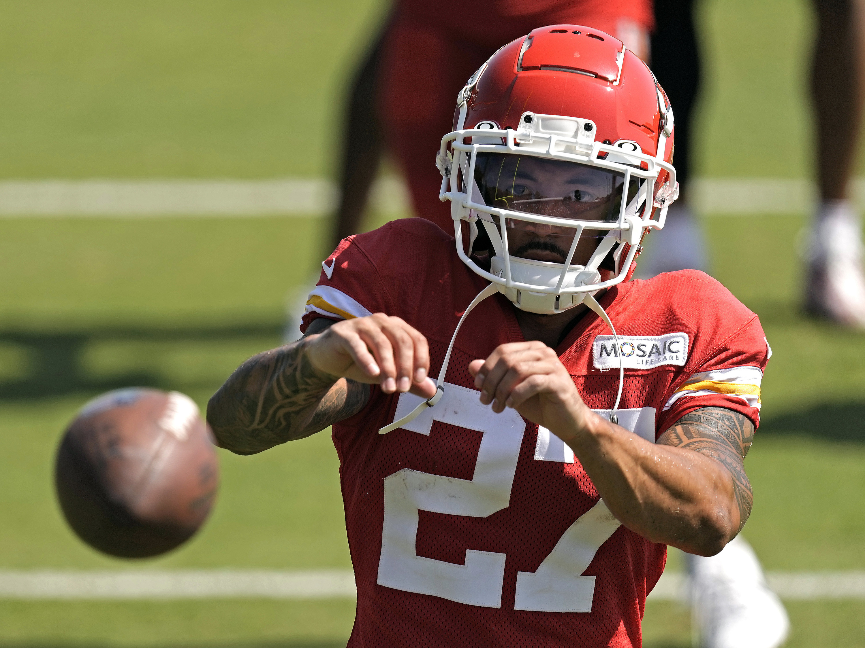 Kansas City Chiefs wide receiver Nikko Remigio catches a ball after NFL football training camp. Photo: AP