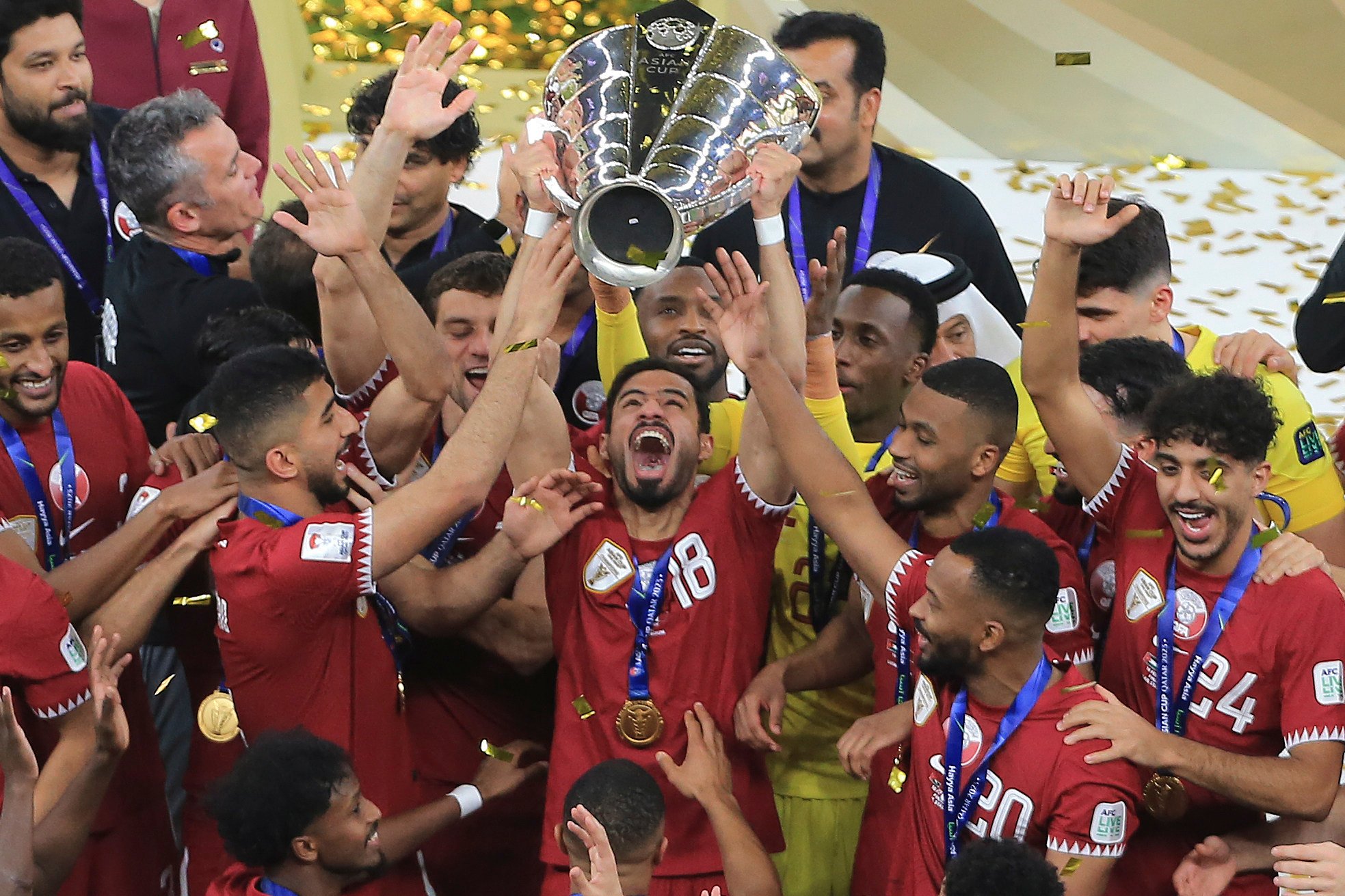 Qatar’s Sultan Al-Brake lifts the trophy after his side won the Asian Cup at Lusail Stadium in Lusail, Qatar, Saturday. Photo: AP