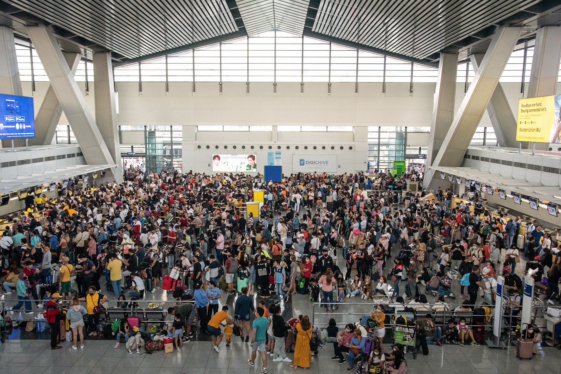 Passengers at Terminal 3 of Manila’s Ninoy Aquino International Airport on January 1, 2023. Photo: AFP 