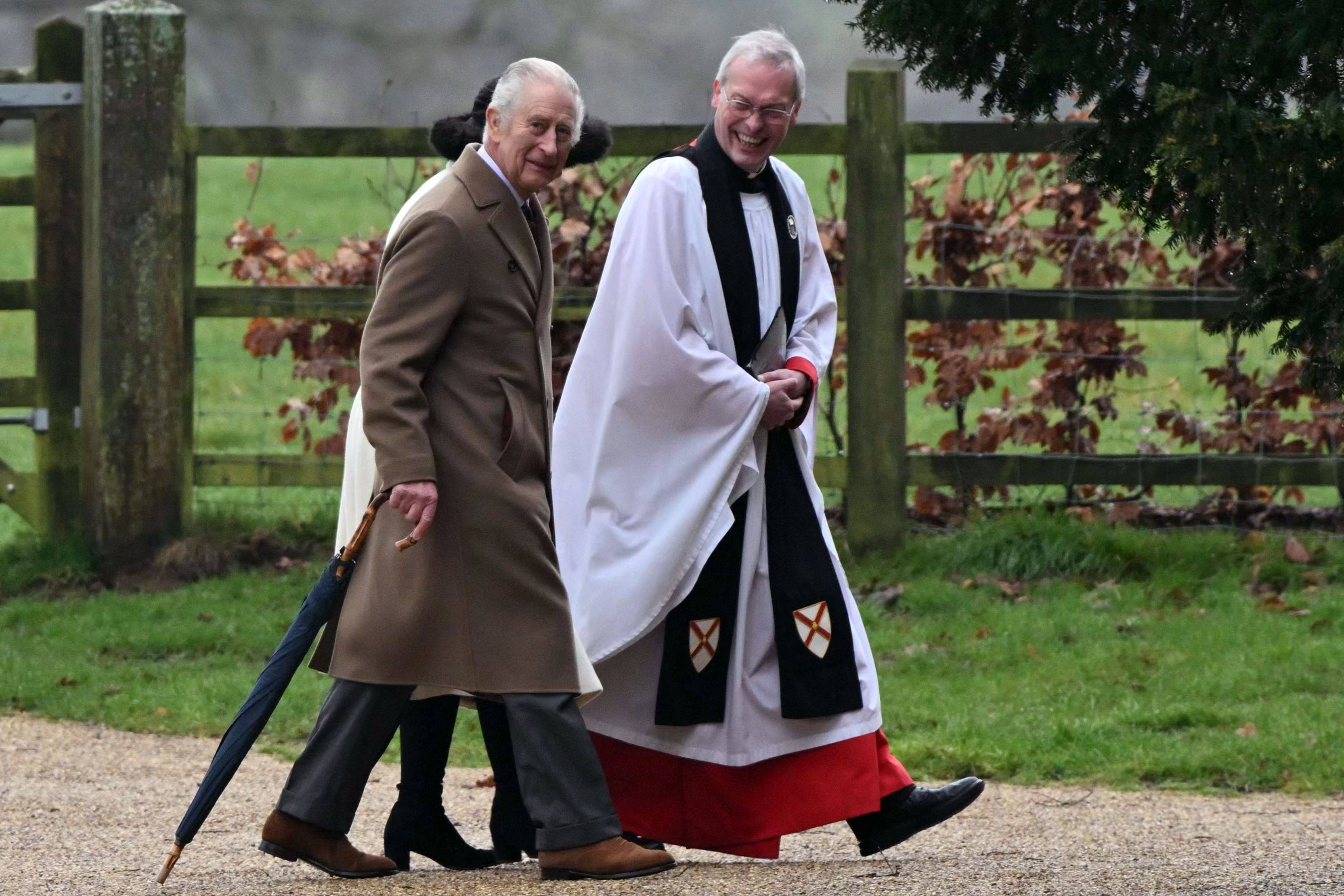 Britain’s King Charles, left, and the Reverend Paul Williams at St Mary Magdalene Church on the Sandringham Estate in Norfolk, England on Sunday. Photo: AFP