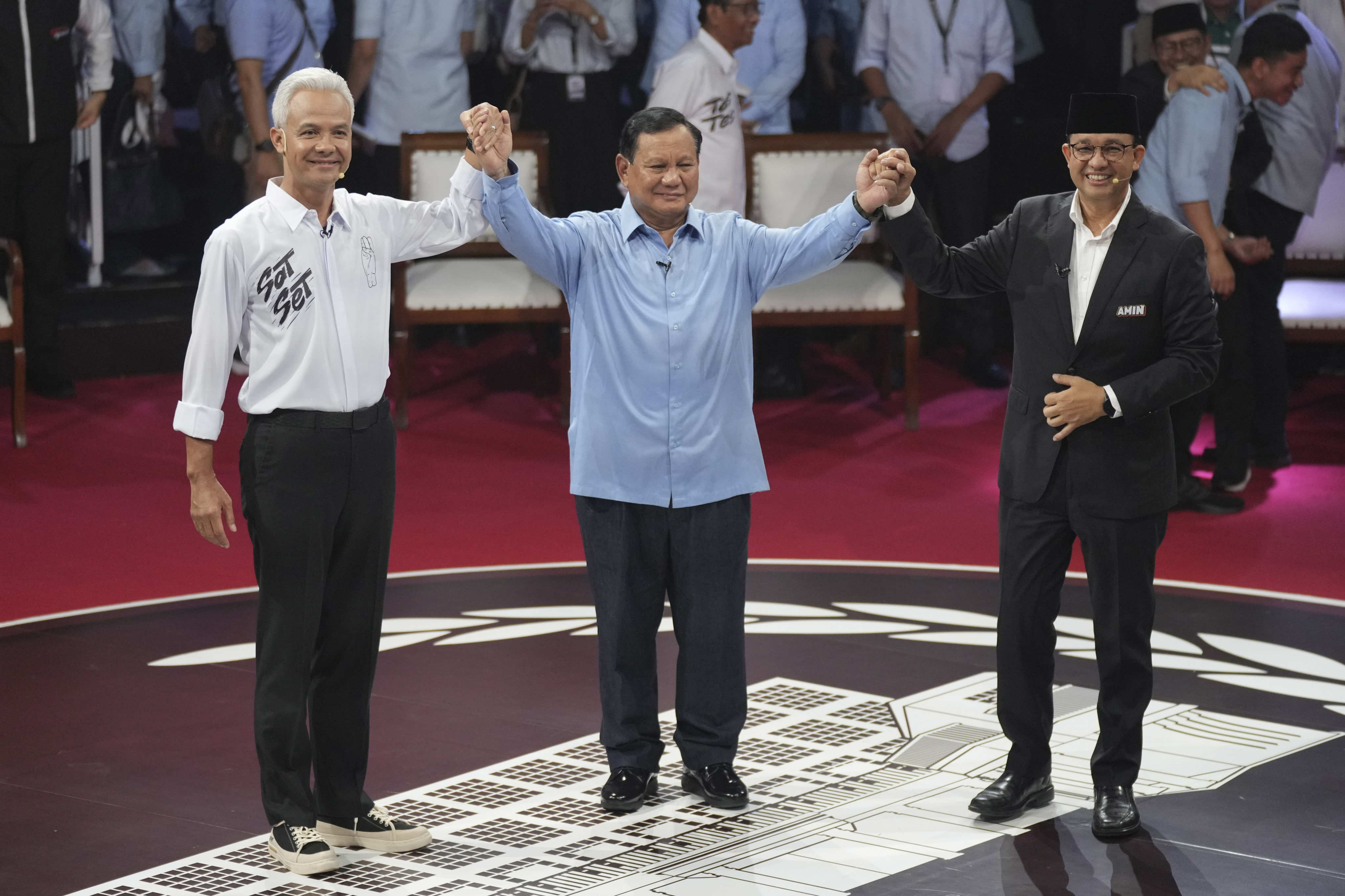 Indonesia’s presidential candidates, from left, Ganjar Pranowo, Prabowo Subianto and Anies Baswedan after the first presidential candidates’ debate in Jakarta on December 12, 2023. Photo: AP