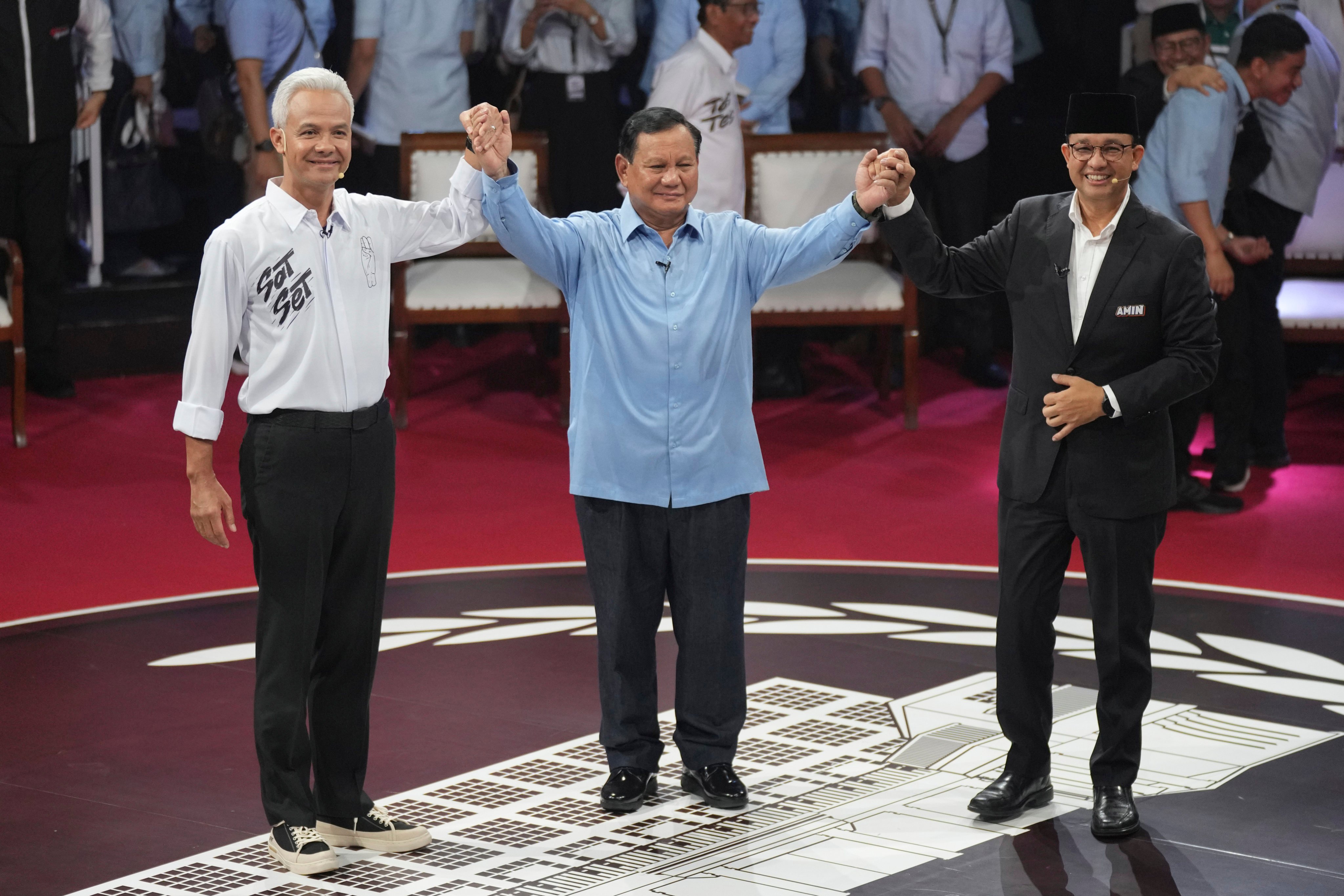 Indonesia’s presidential candidates, from left, Ganjar Pranowo, Prabowo Subianto and Anies Baswedan after the first presidential candidates’ debate in Jakarta on December 12, 2023. Photo: AP