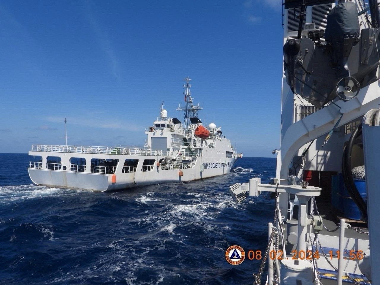 A China Coast Guard ship manoeuvres near Philippine Coast Guard vessel BRP Teresa Magbanua near the Scarborough Shoal on February 8. Photo: Philippine Coast Guard via Reuters