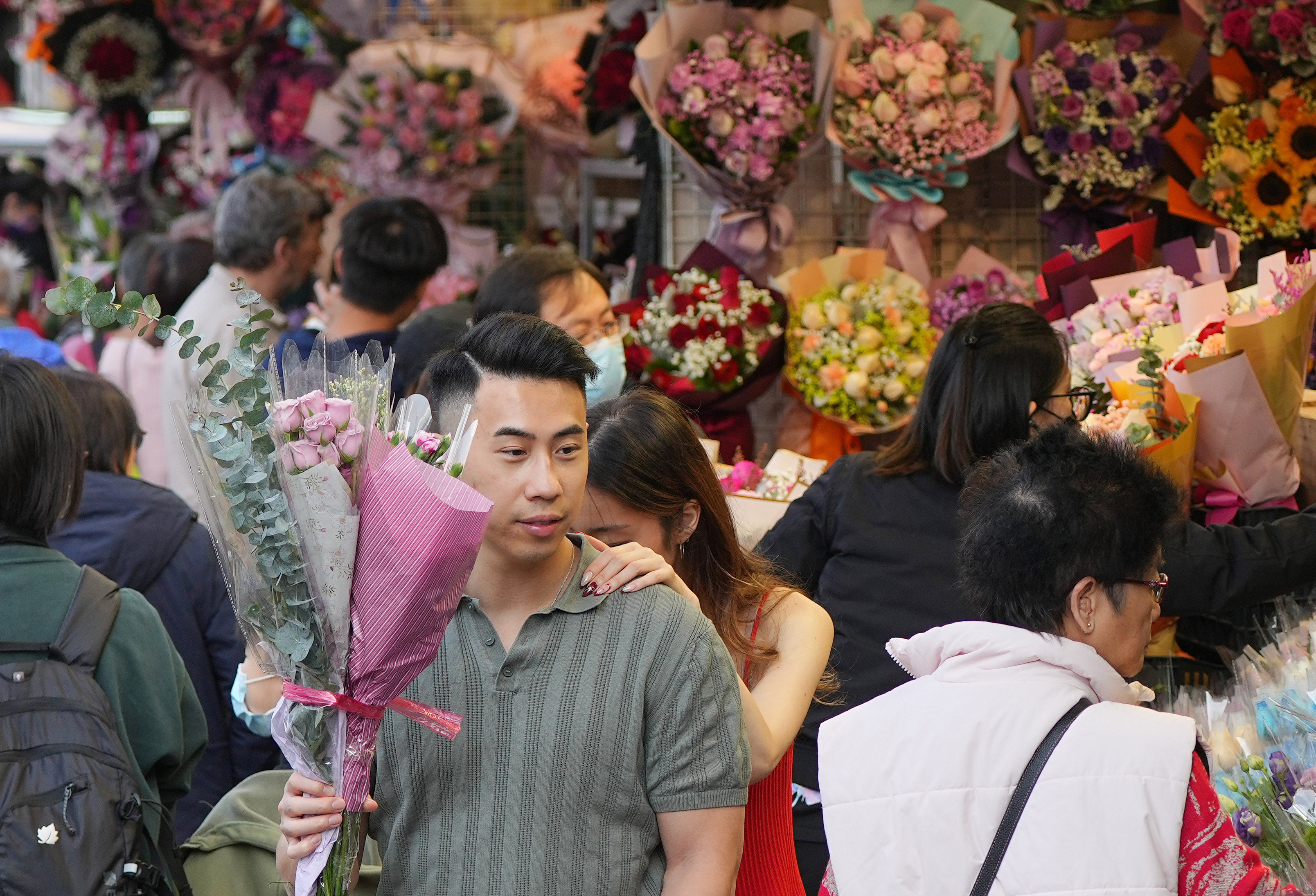 People shop for flowers ahead of Valentine’s Day in Flower Market, Mong Kok. Florists say residents have been tightening their belts. Photo: Eugene Lee