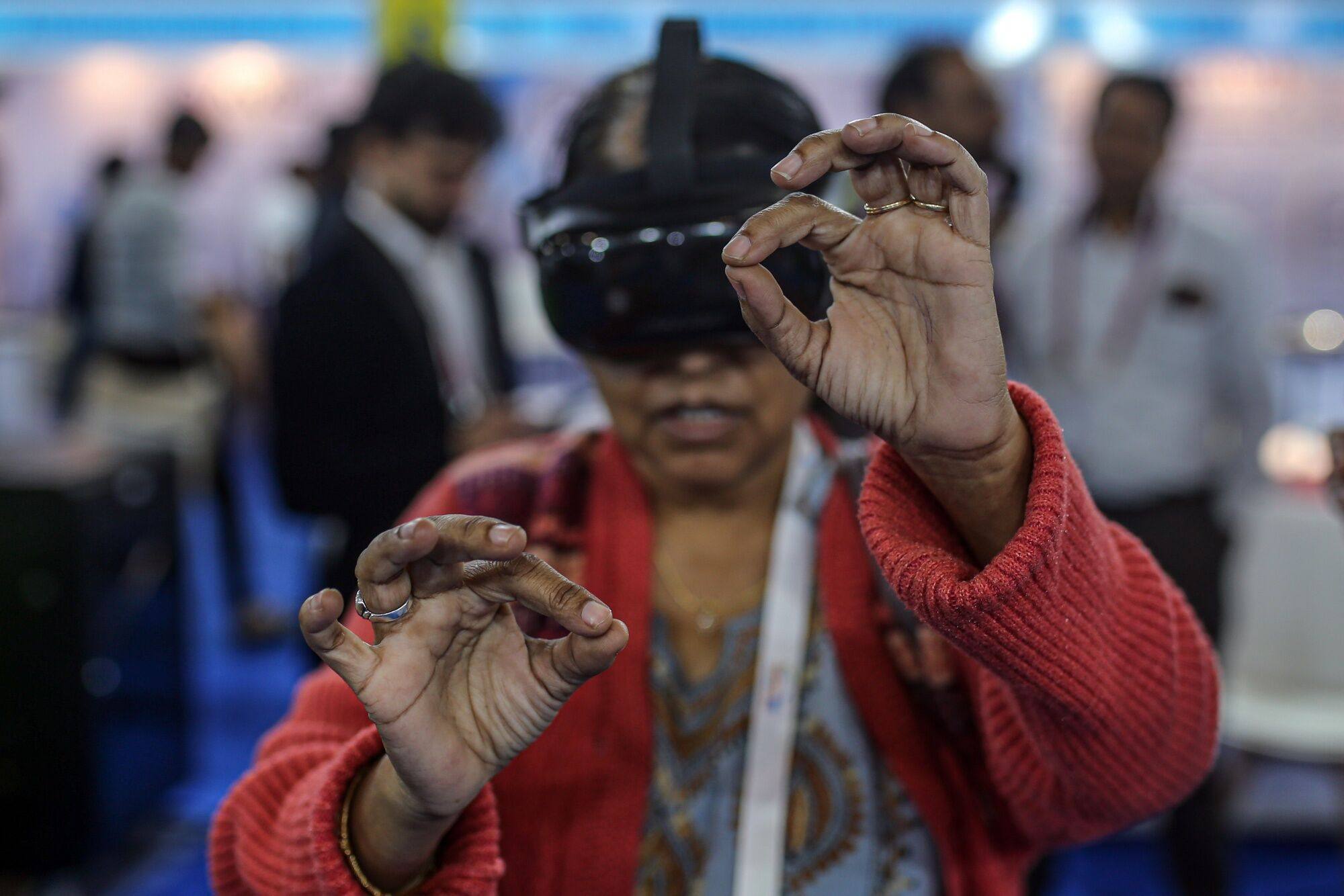 An attendee tries a virtual reality headset during the Vibrant Gujarat Global Summit in Gandhinagar, Gujarat, India. Photo: Bloomberg