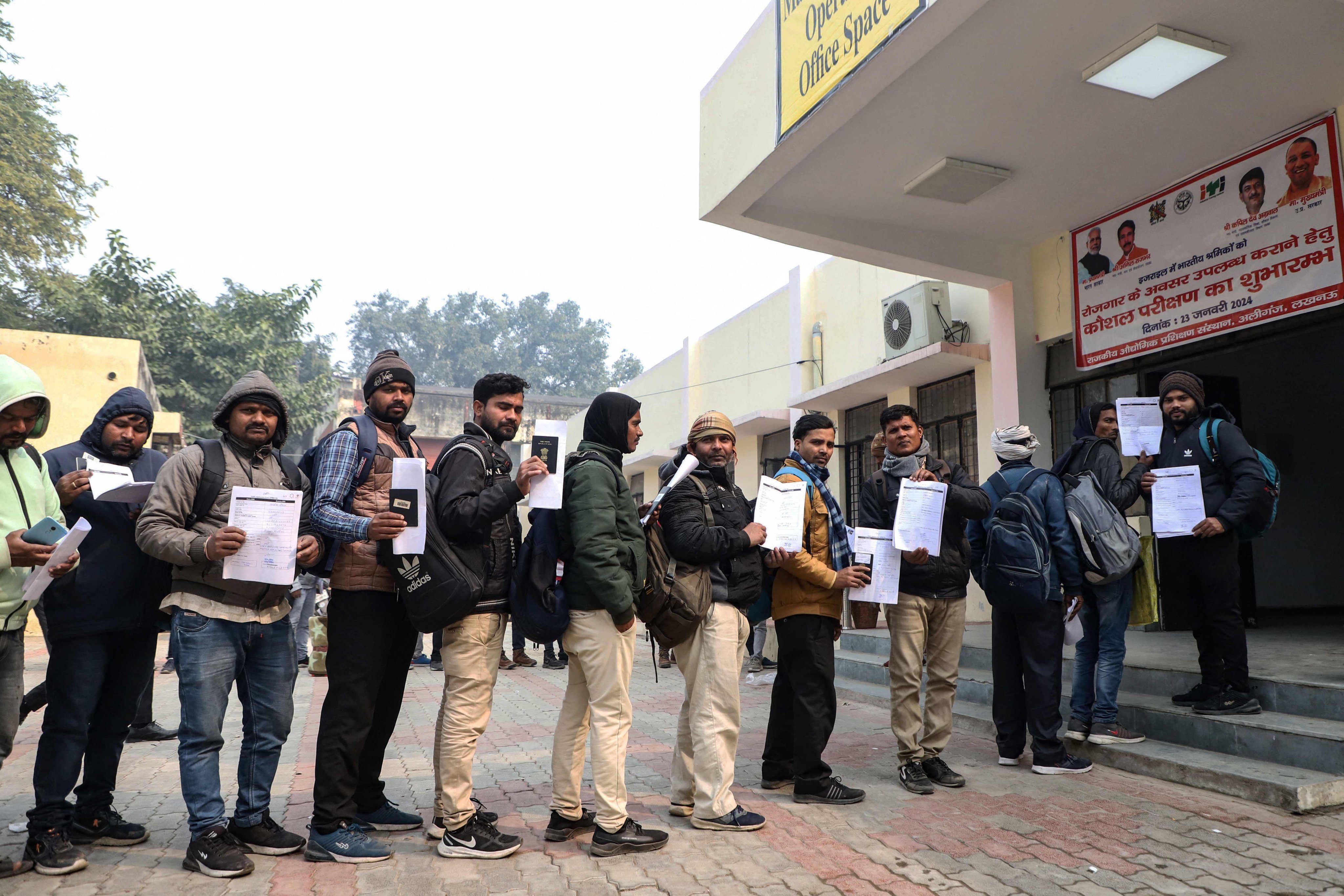 Indian workers wait to submit registration forms in Lucknow as they seek employment in Israel. Photo: AFP