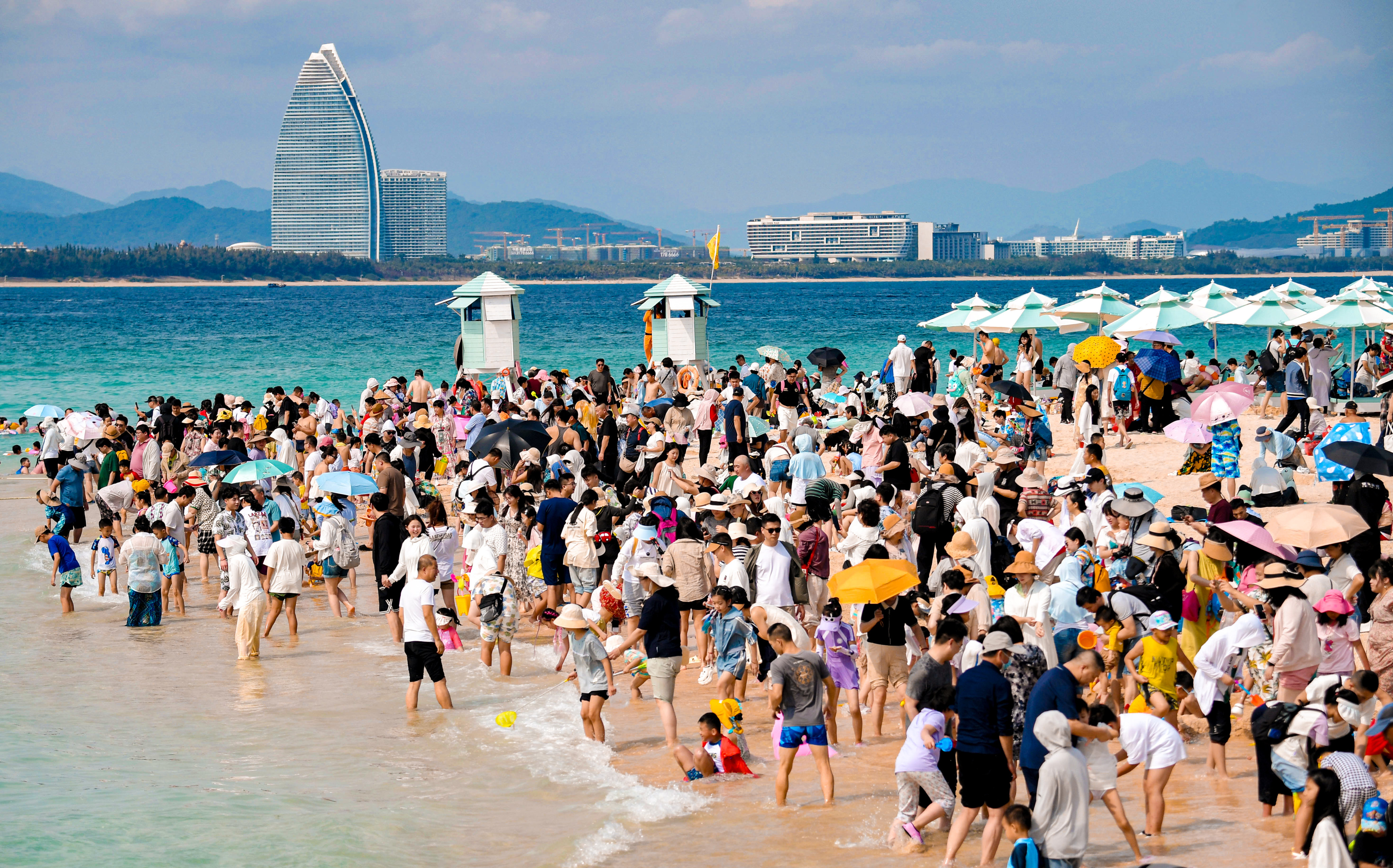 A crowded beach in Hainan earlier this month. Some travellers said they had been caught out by the high numbers travelling to the island, one of China’s main destinations. Photo: Xinhua