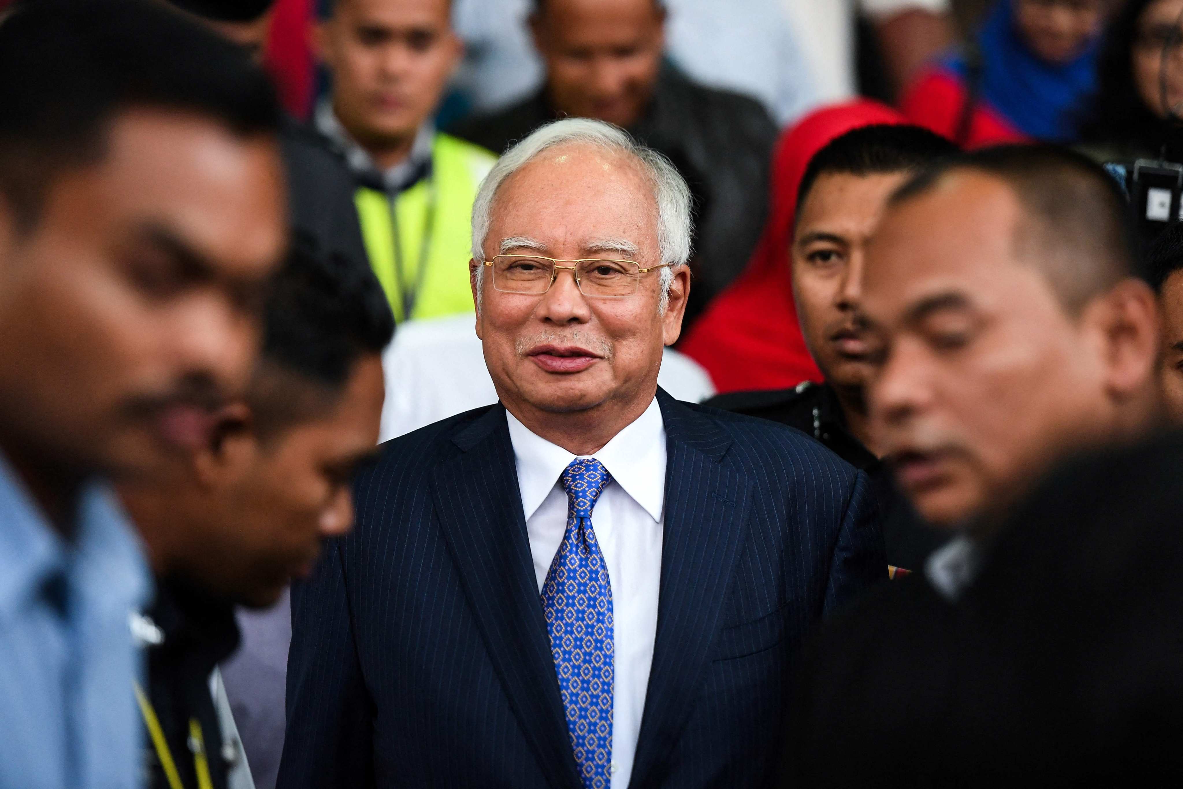 Malaysia’s former prime minister Najib Razak (centre) leaves a court in Kuala Lumpur on April 3, 2019, after facing trial in a case related to the looting of the sovereign wealth fund 1MDB. Photo: AFP