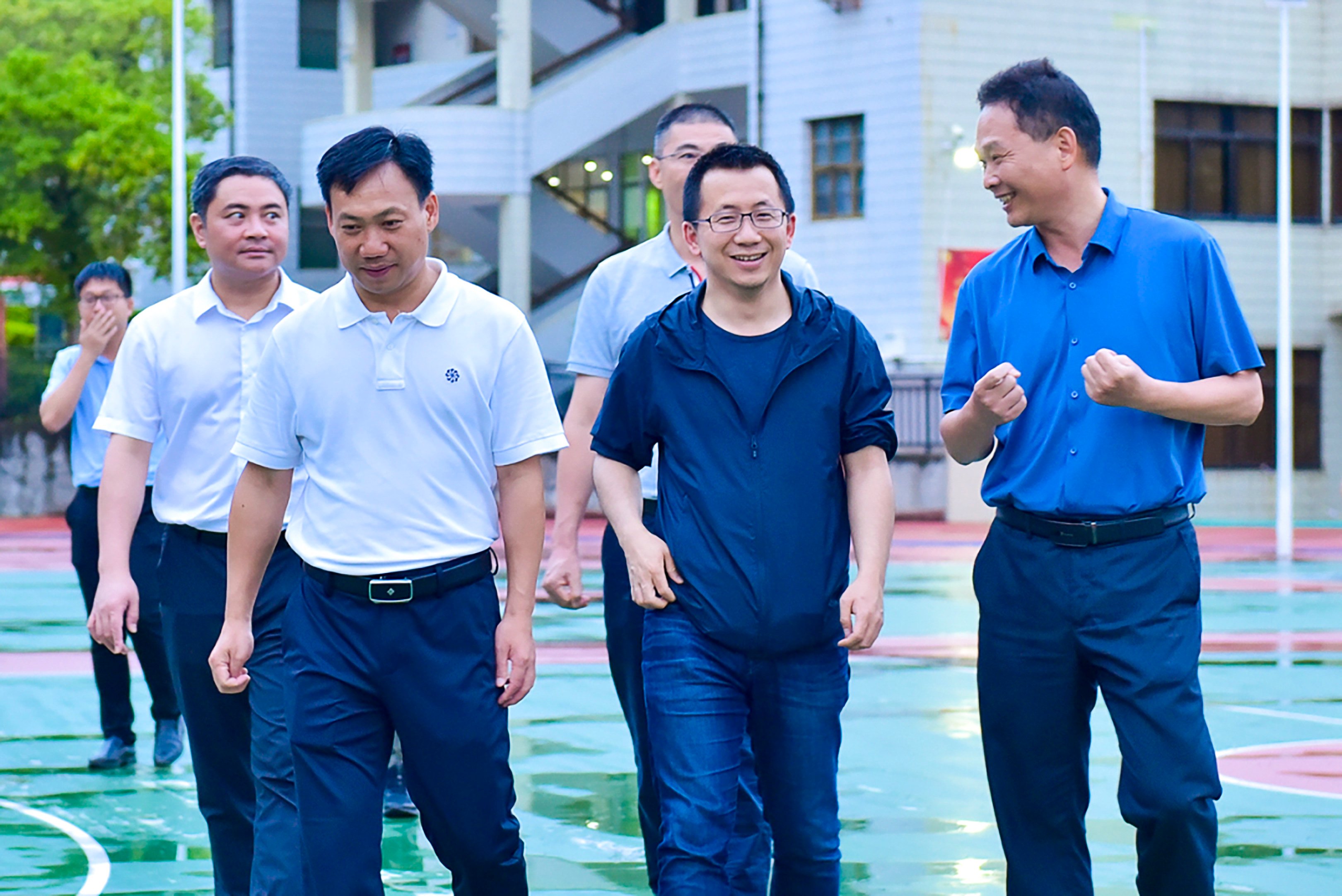 Zhang (centre) has maintained a low profile since stepping down as chairman of ByteDance in 2021. Photo: Longyan Education Bureau