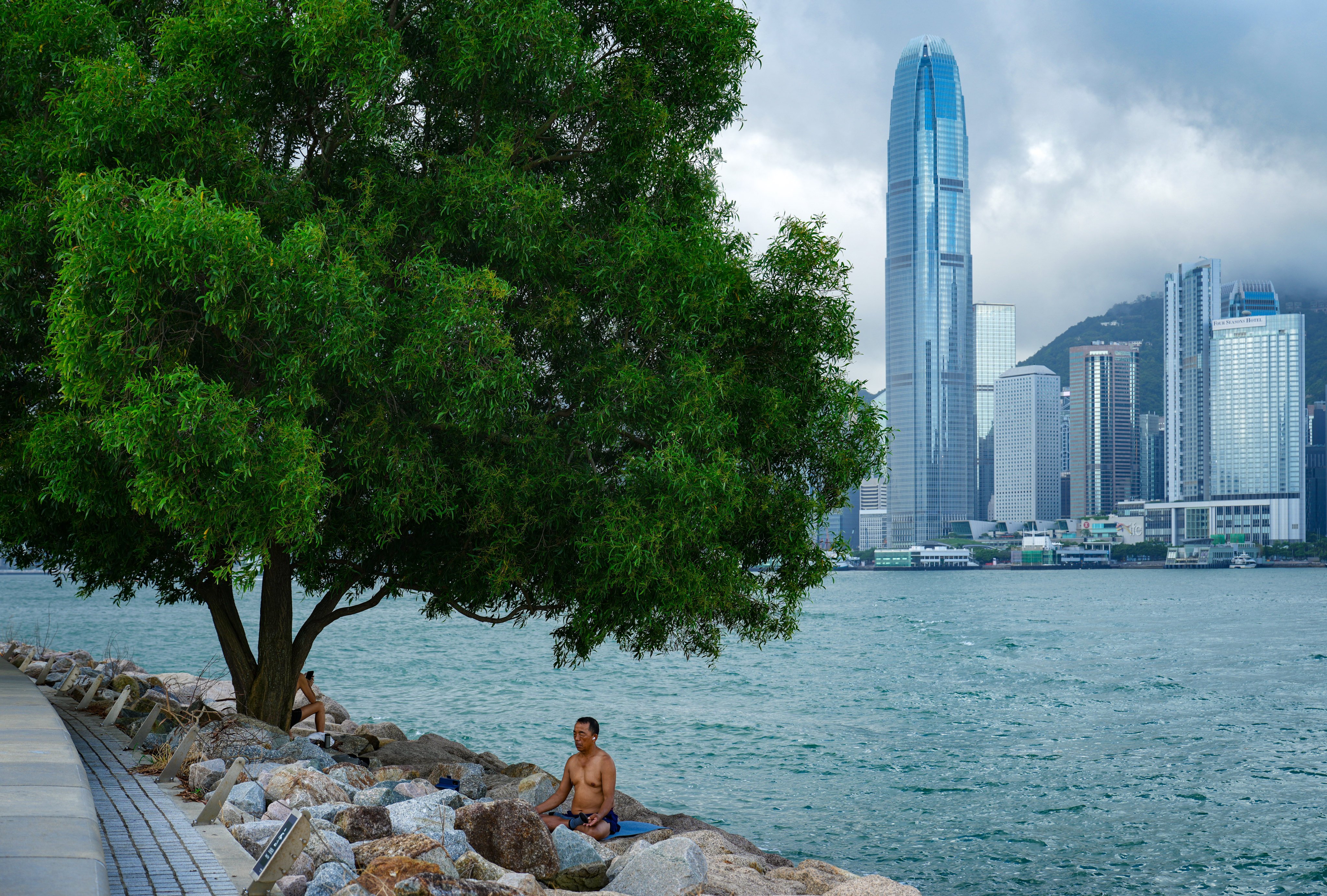 A man meditates at the West Kowloon Cultural District waterfront. Photo: Sam Tsang