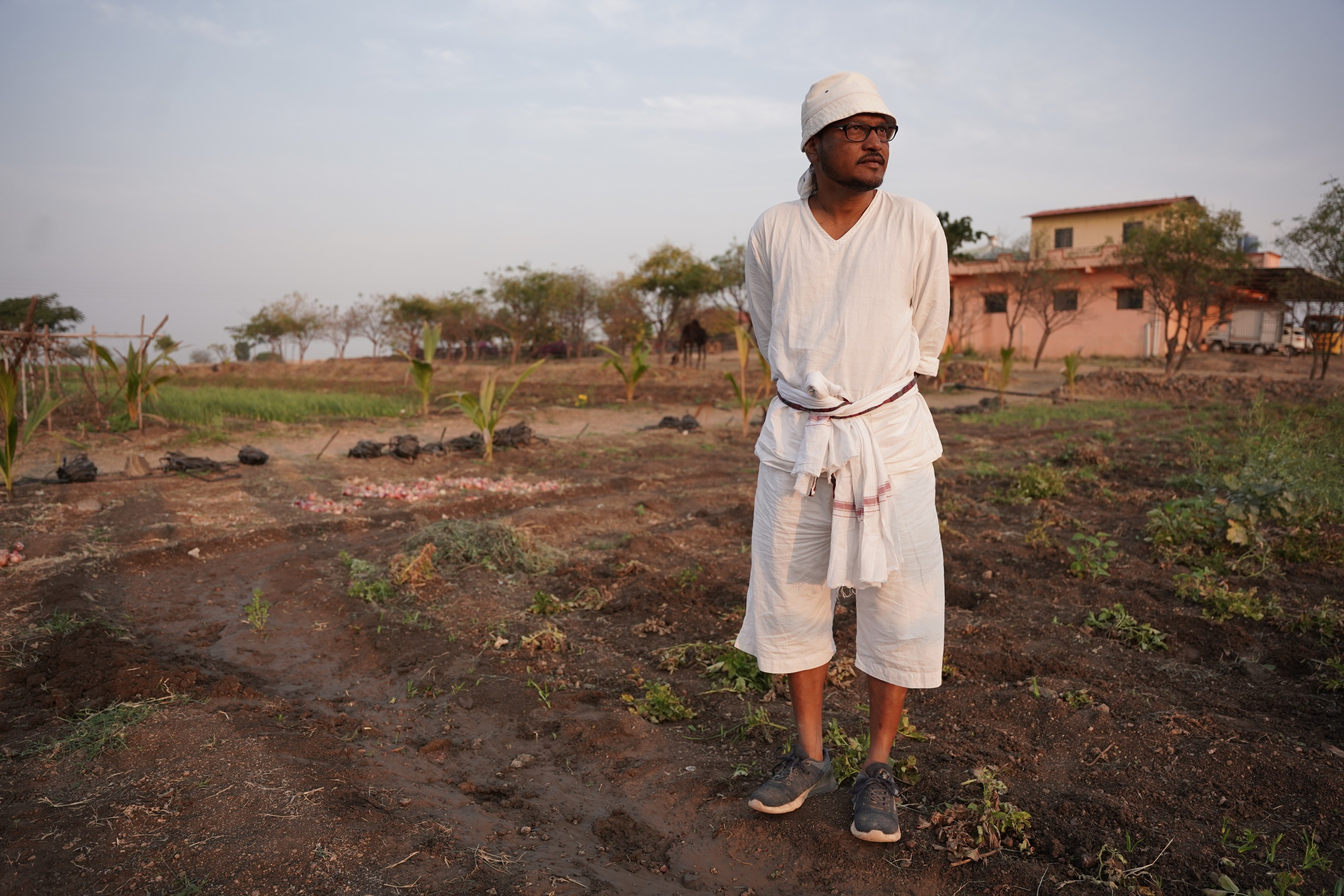Ravi Kant Bapatle stands in the farm at Happy Indian Village. Photo: Bhat Burhan
