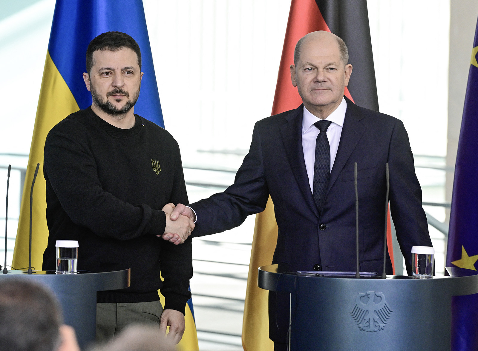 German Chancellor Olaf Scholz (right) and Ukraine’s President Volodymyr Zelensky shake hands in Berlin on Friday. Photo: AFP via Getty Images/TNS