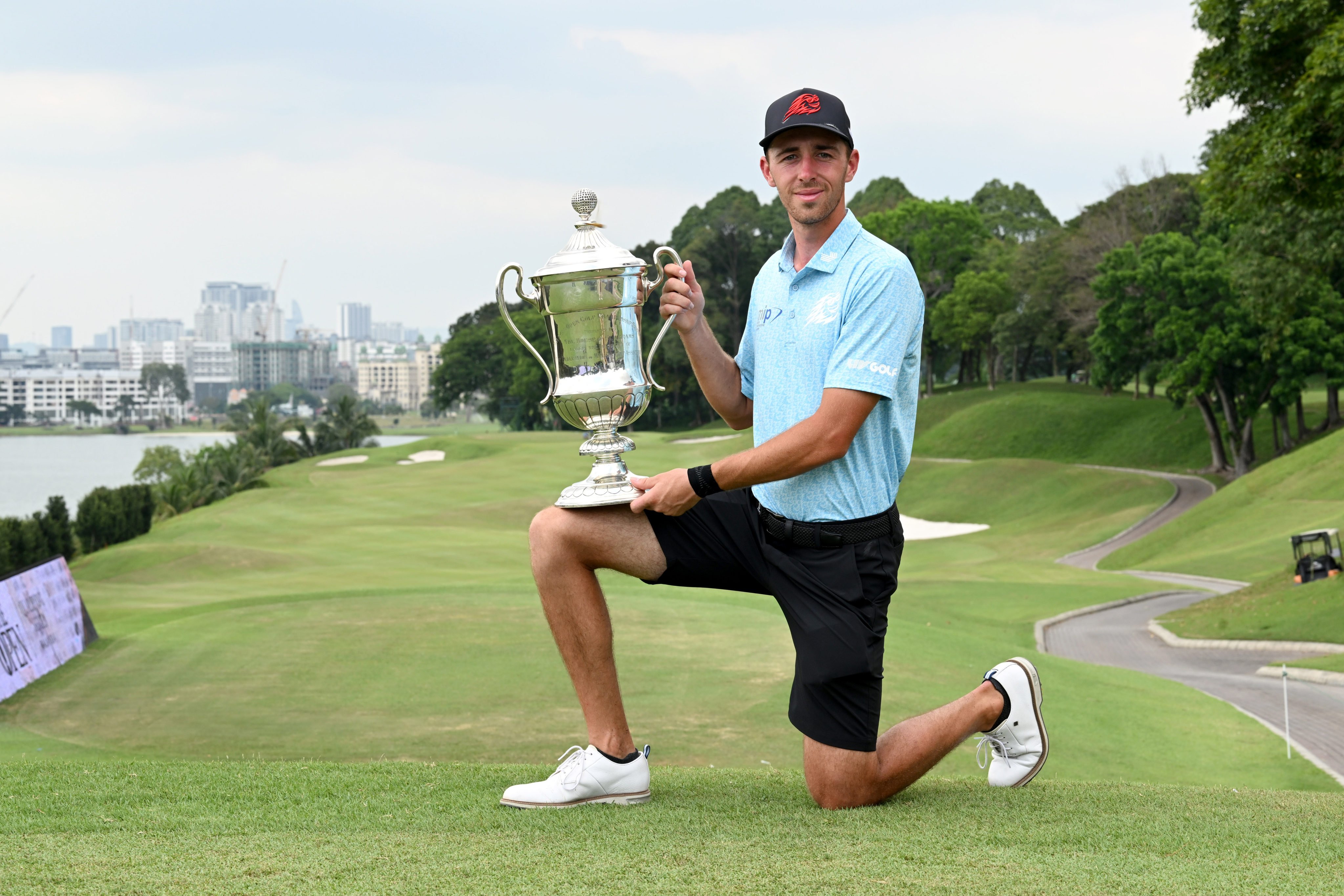 David Puig holds The Seagram Trophy after winning the Malaysian Open. Photo: Asian Tour.
