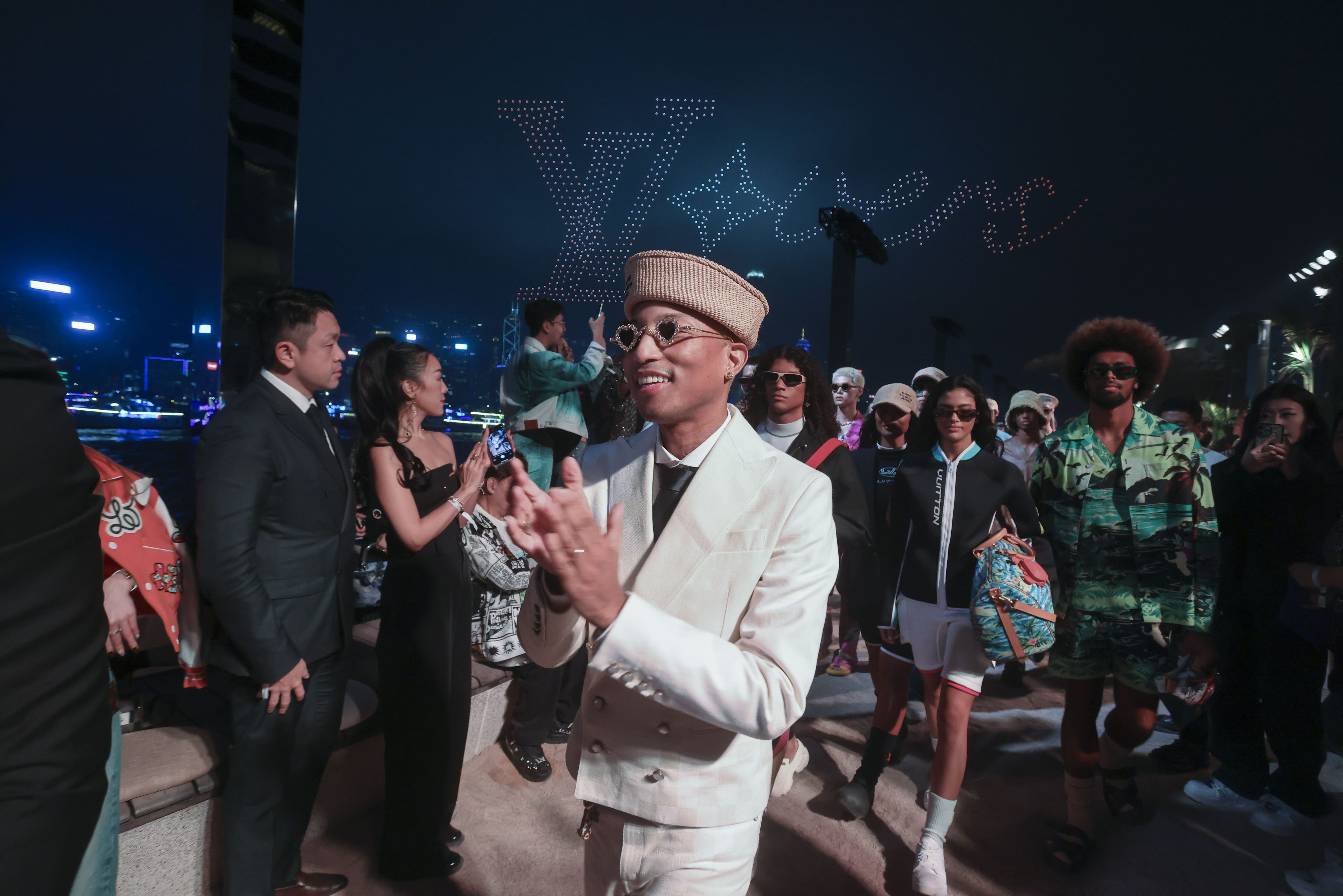 Pharrell Williams (centre), the men’s creative director of Louis Vuitton, attends the brand’s fashion show in Tsim Sha Tsui last November. A think tank is calling on authorities to make better use of the harbour. Photo: Jonathan Wong