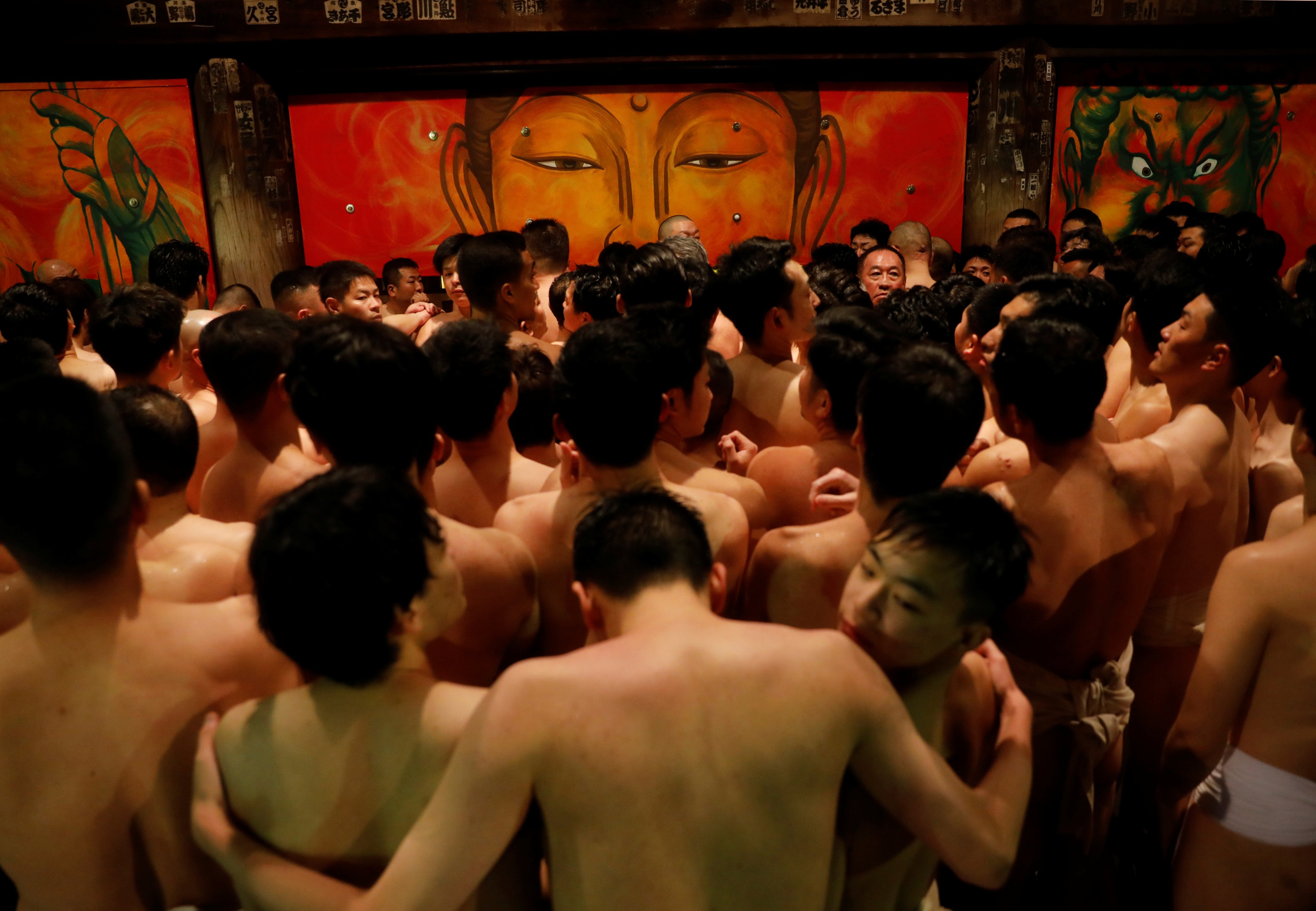 Men dressed in loincloths prepare to snatch a wooden stick called “shingi” tossed by the priest during a naked festival at Saidaiji Temple in Okayama, Okayama Prefecture Japan. Photo: Reuters
