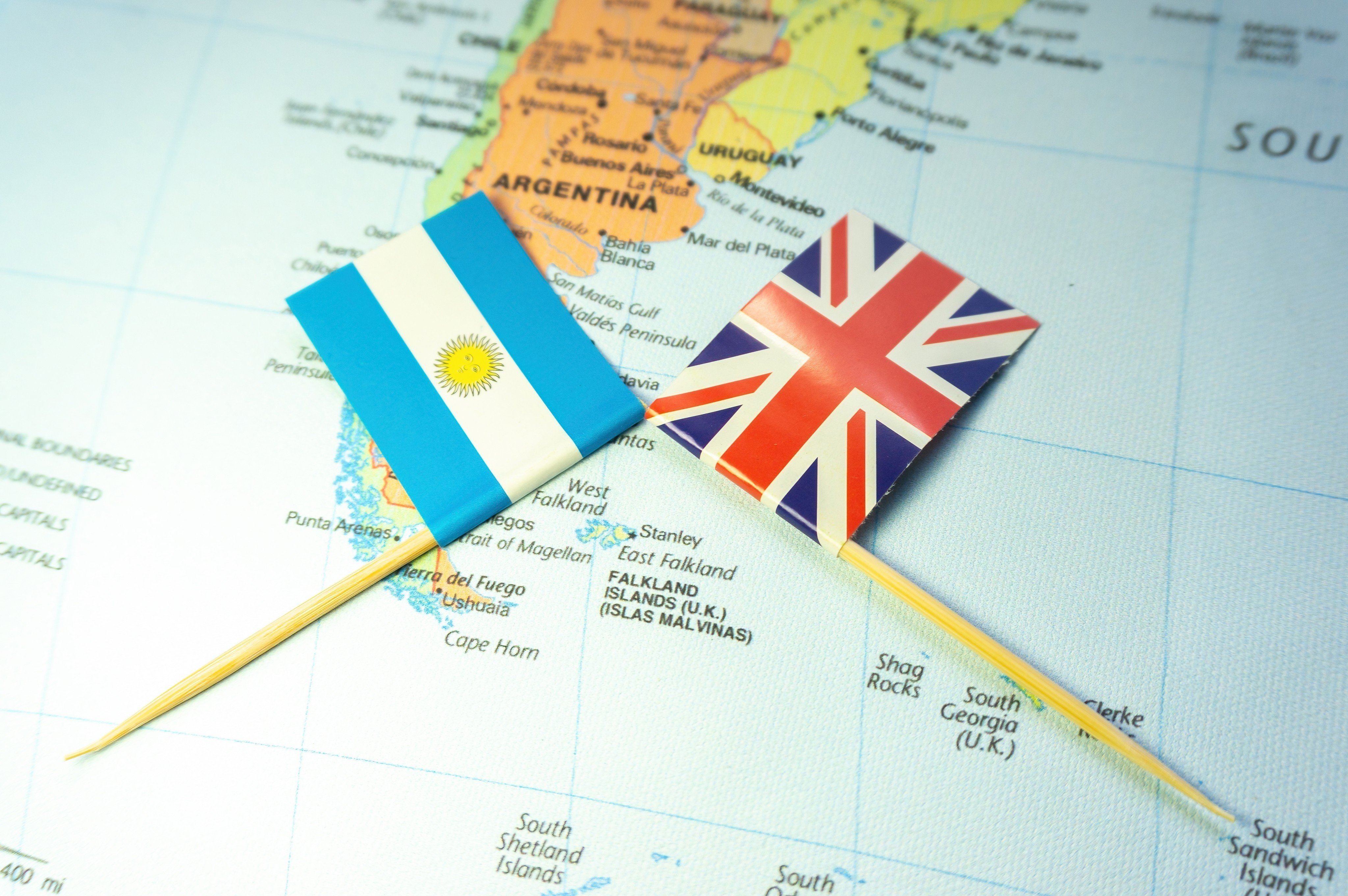 Argentine and British flags placed around the Falkland Islands or the Malvinas Islands. Photo: Shutterstock