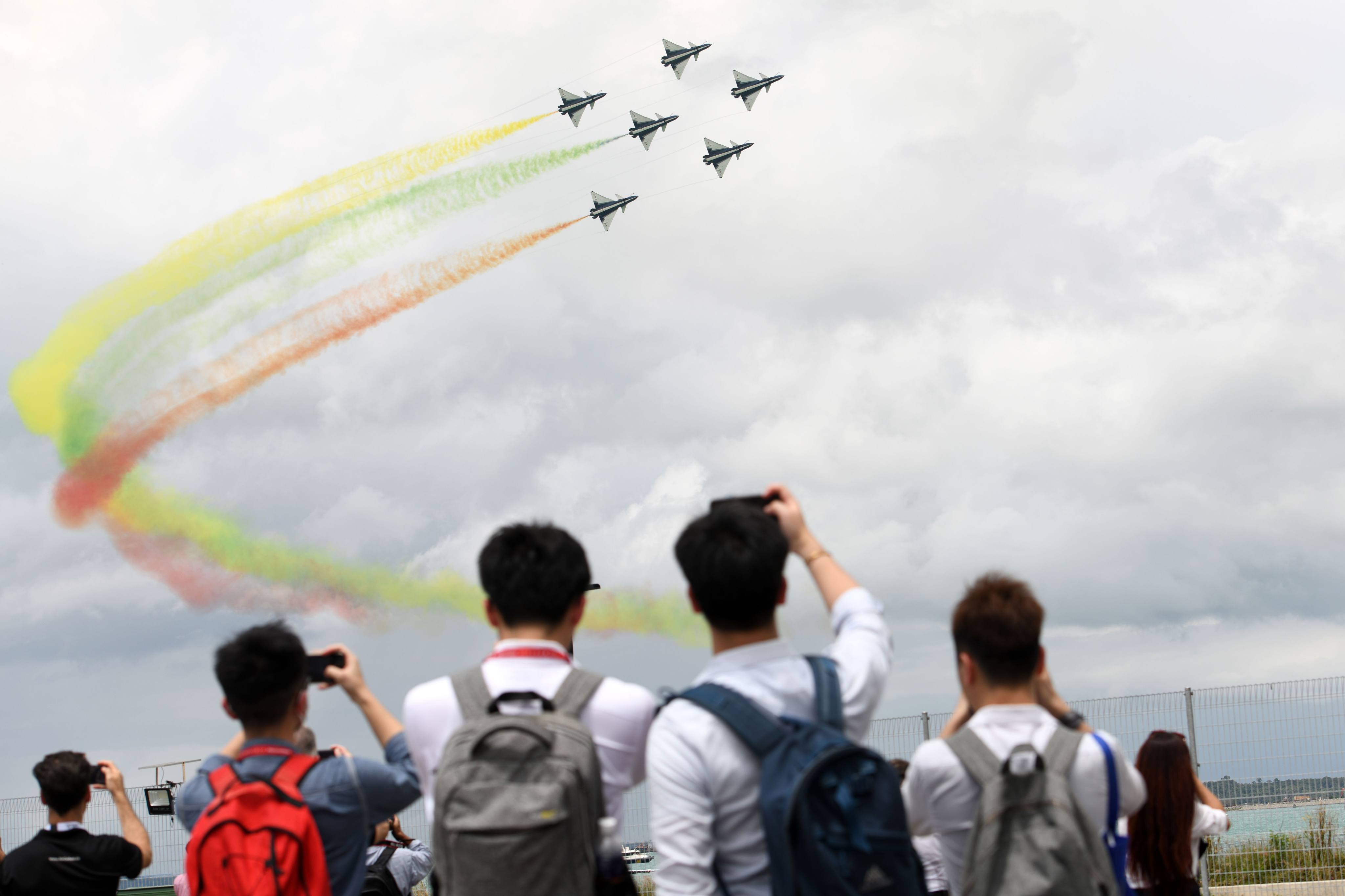 The Chinese People’s Liberation Army Air Force’s Bayi Aerobatic Team fly J-10 fighter jets perform an aerial display during the 2020 Singapore Airshow. Photo: AFP