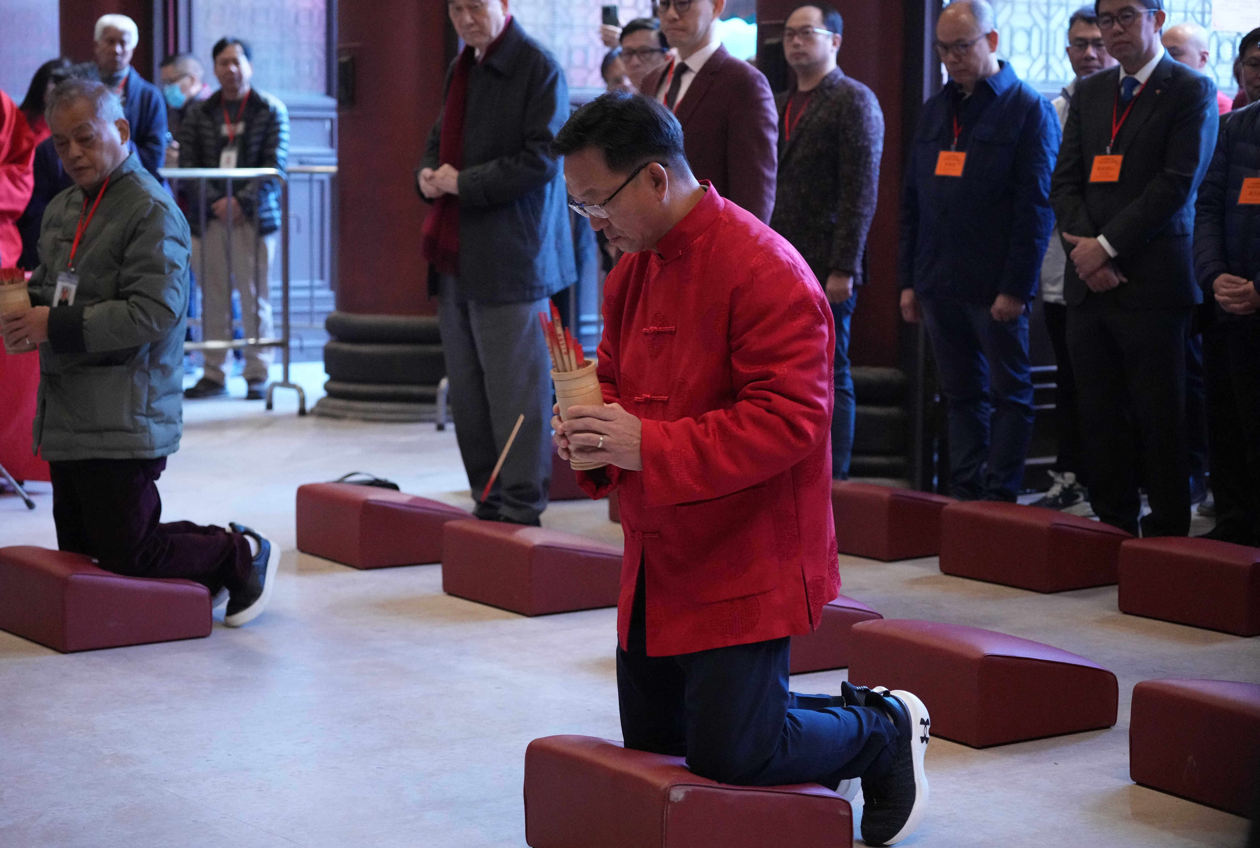 Kenneth Lau Ip-keung, chairman of the Heung Yee Kuk, takes part in fortune-stick-drawing ritual at Che Kung Temple in Sha Tin, on the second day of Lunar New Year, on February 11. Photo: Eugene Lee