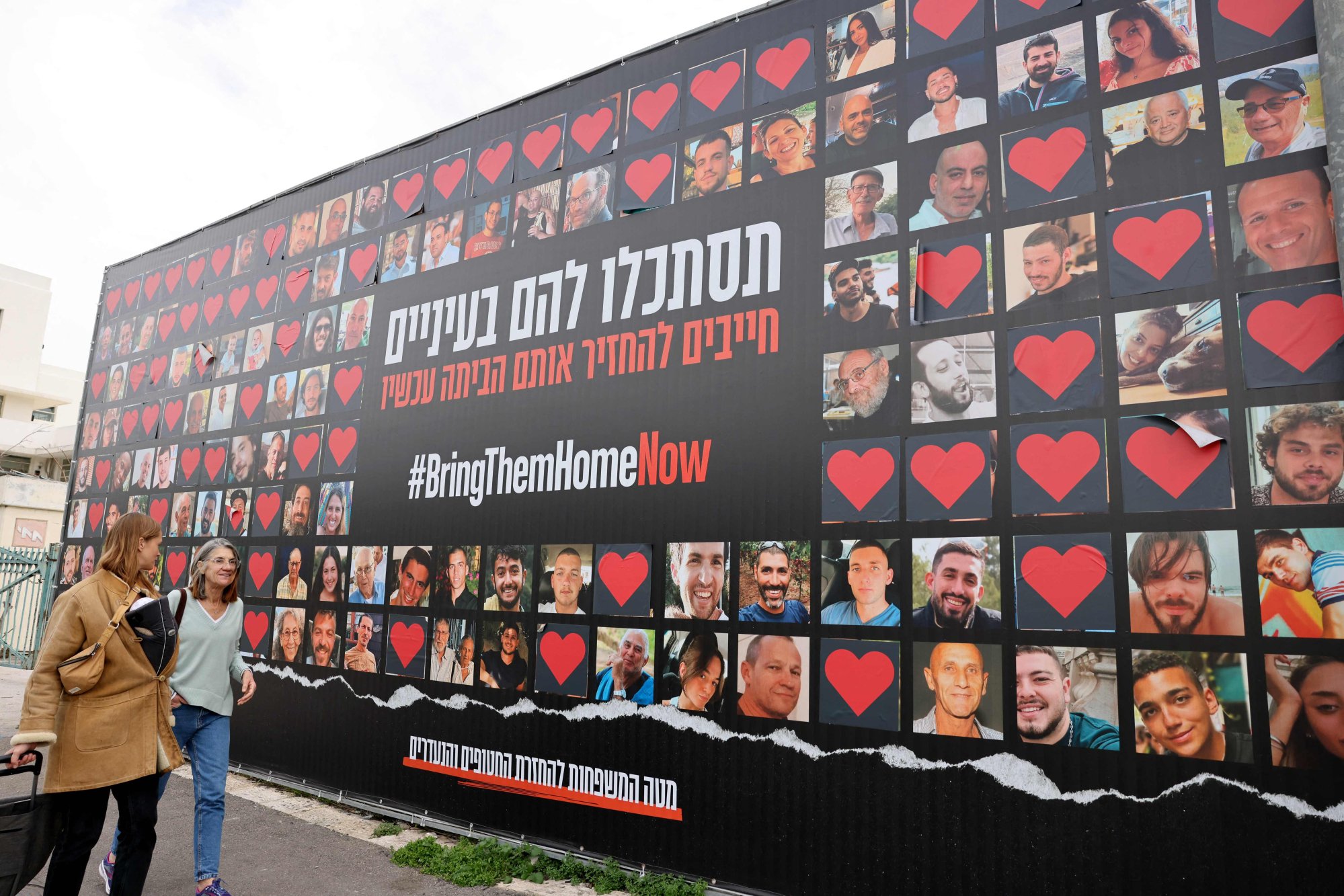 A wall in Jerusalem bearing portraits of Israeli hostages. Photo: AFP