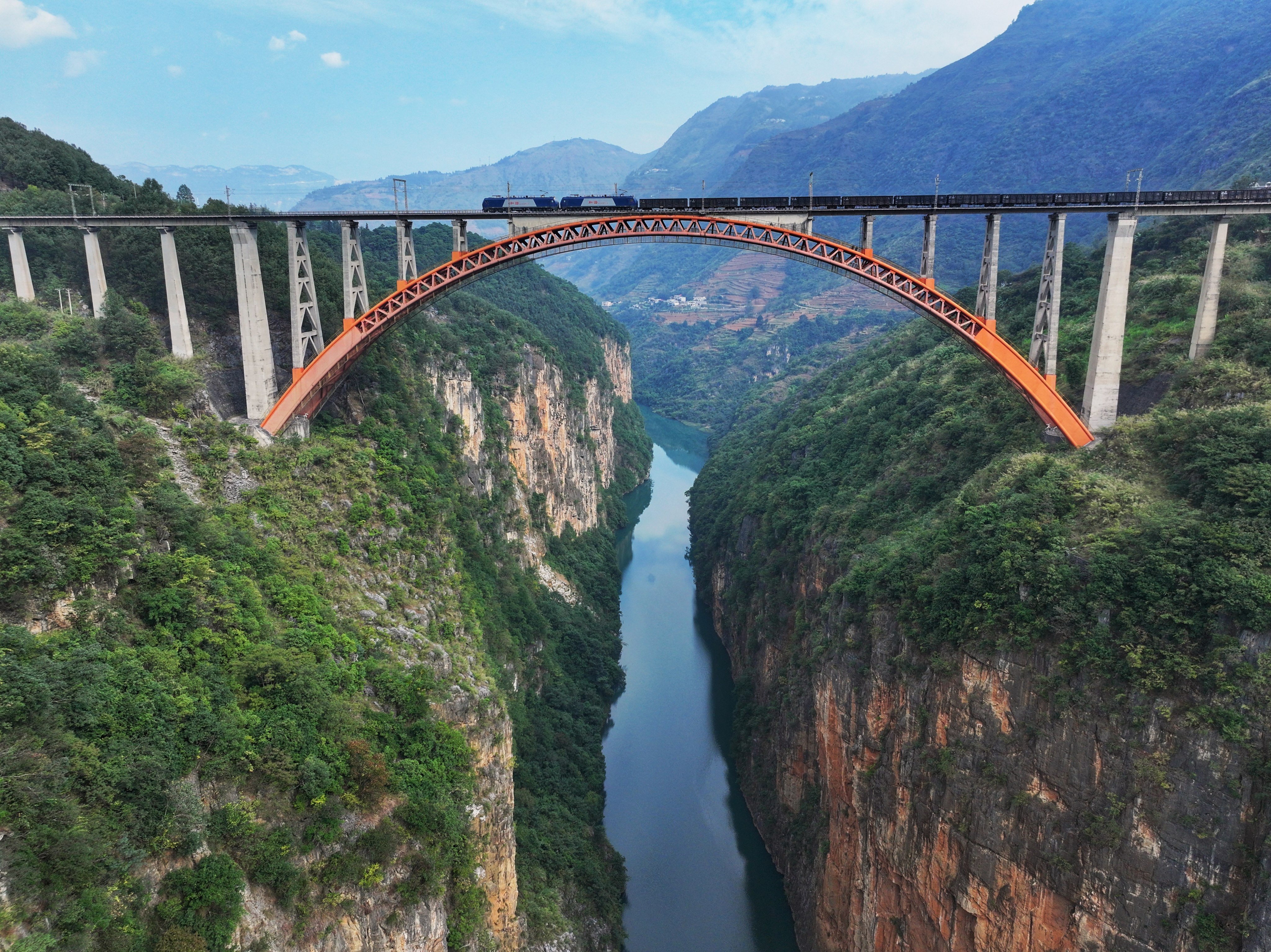 A freight train crosses a bridge near Liupanshui, Guizhou province, China. Photo: Wang Lu