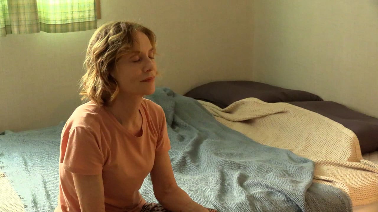 Isabelle Huppert in a still from A Traveler’s Needs. Photo: Jeonwonsa Film Co
