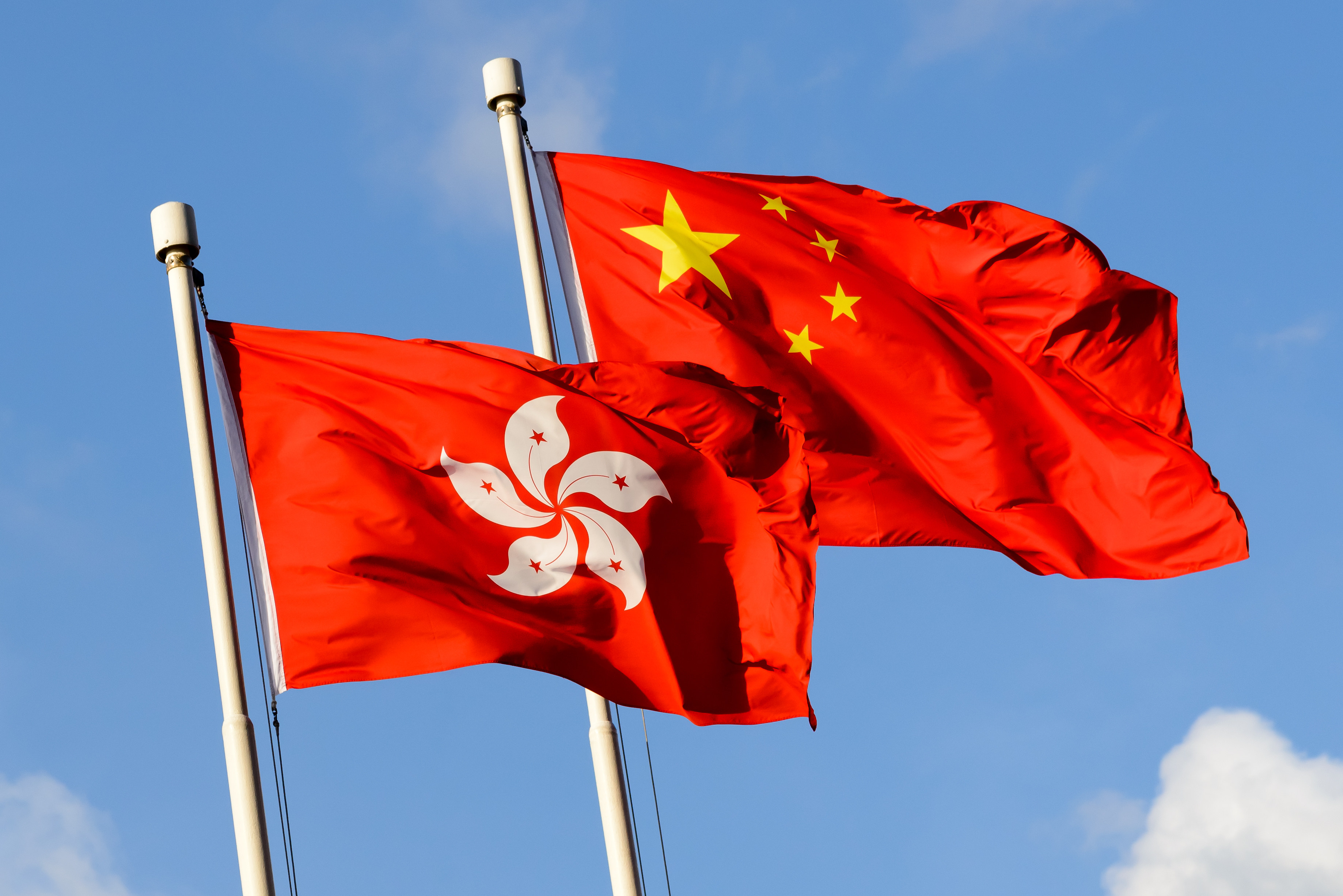 China and Hong Kong flags. Top Beijing official Xia Baolong will begin his six-day trip to Hong Kong on Thursday. Photo: Shutterstock
