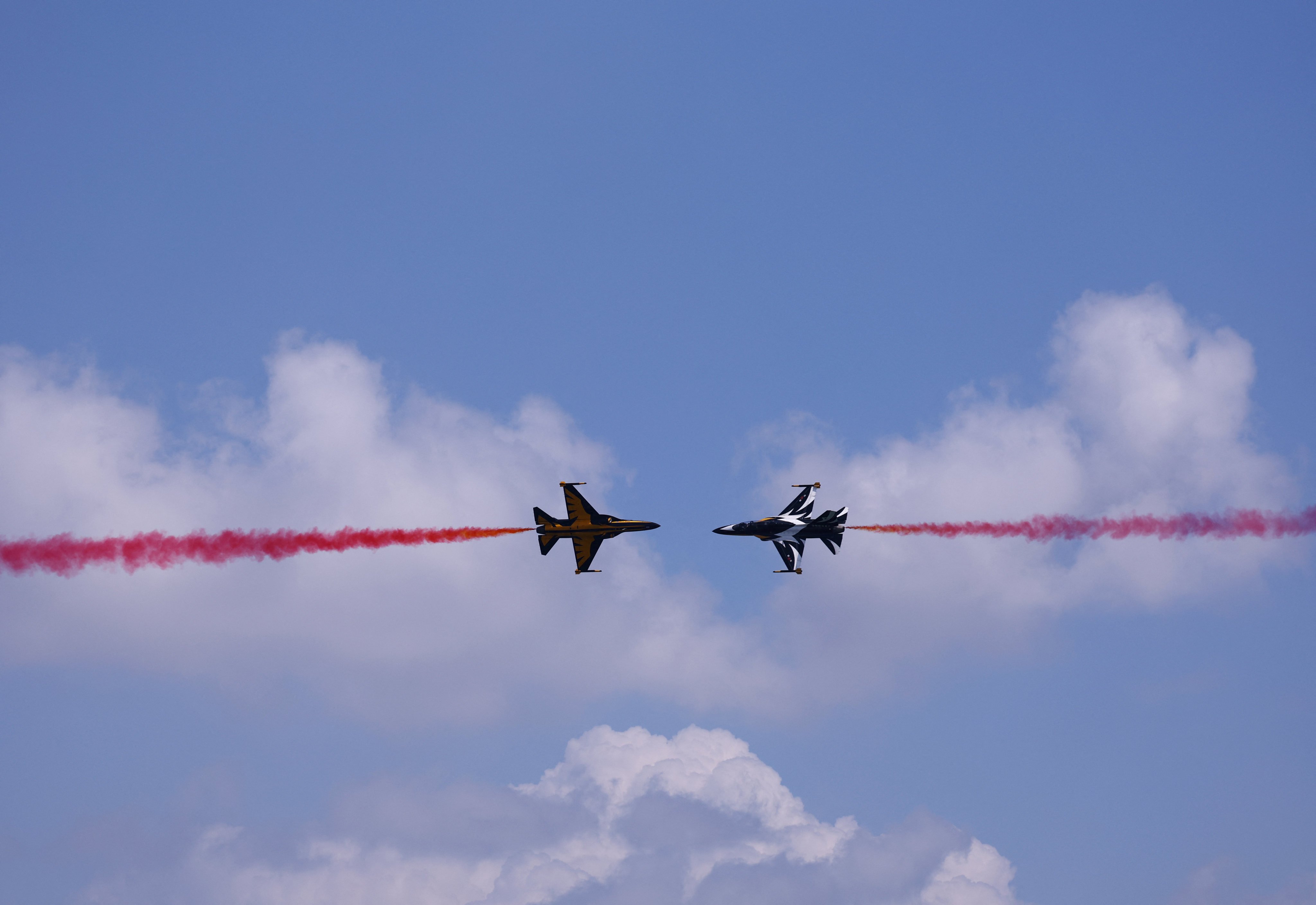 South Korea’s Black Eagles aerobatic team perform at Changi Exhibition Centre during an aerial flying display on Sunday ahead of the Singapore Airshow’s opening. Photo: Reuters