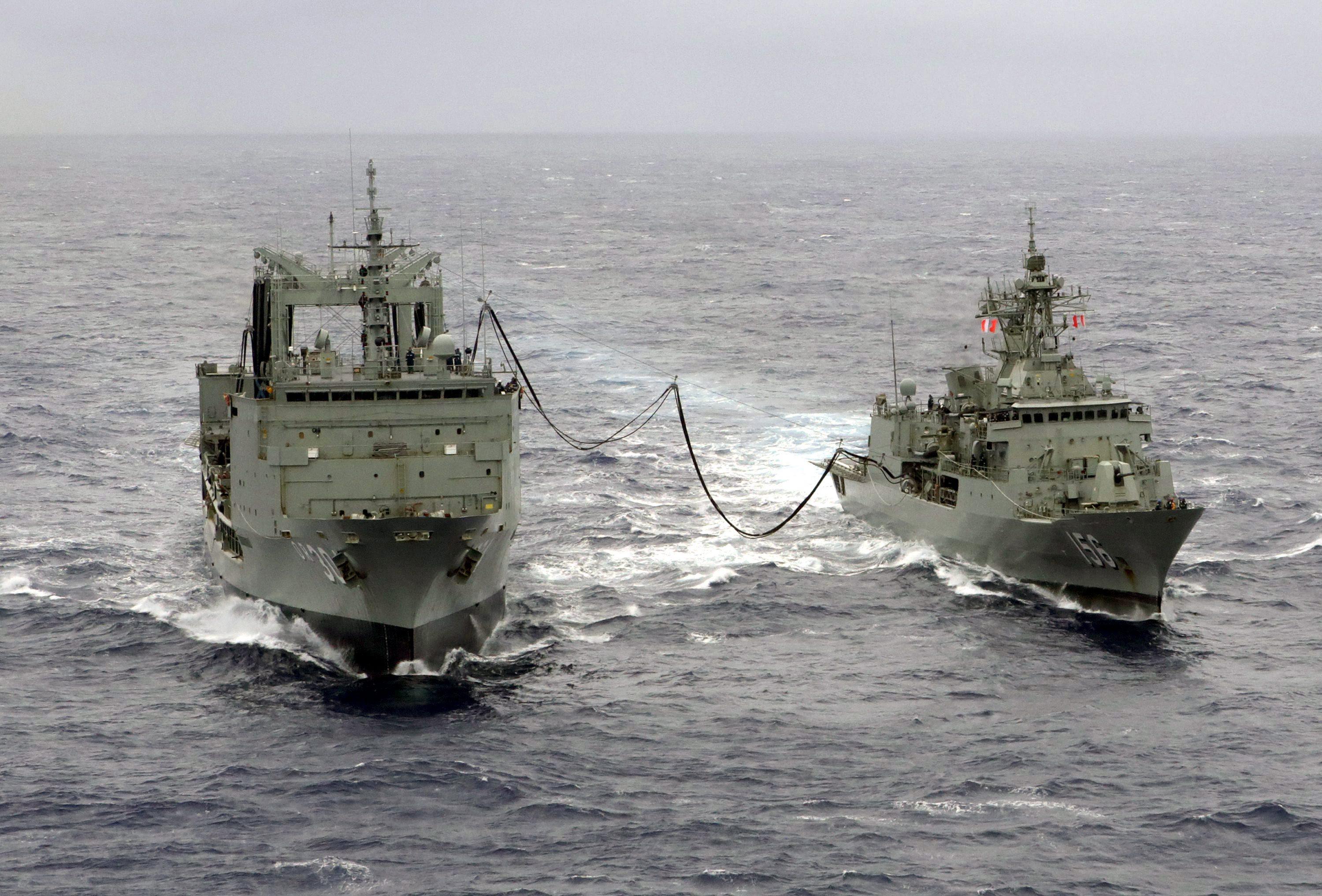 HMAS Toowoomba (right) of the Royal Australian Navy conducts a replenishment-at-sea exercise in 2014. Australia’s current fleet is the oldest the country’s navy has ever operated. Photo: Australian Department of Defence/Handout via EPA