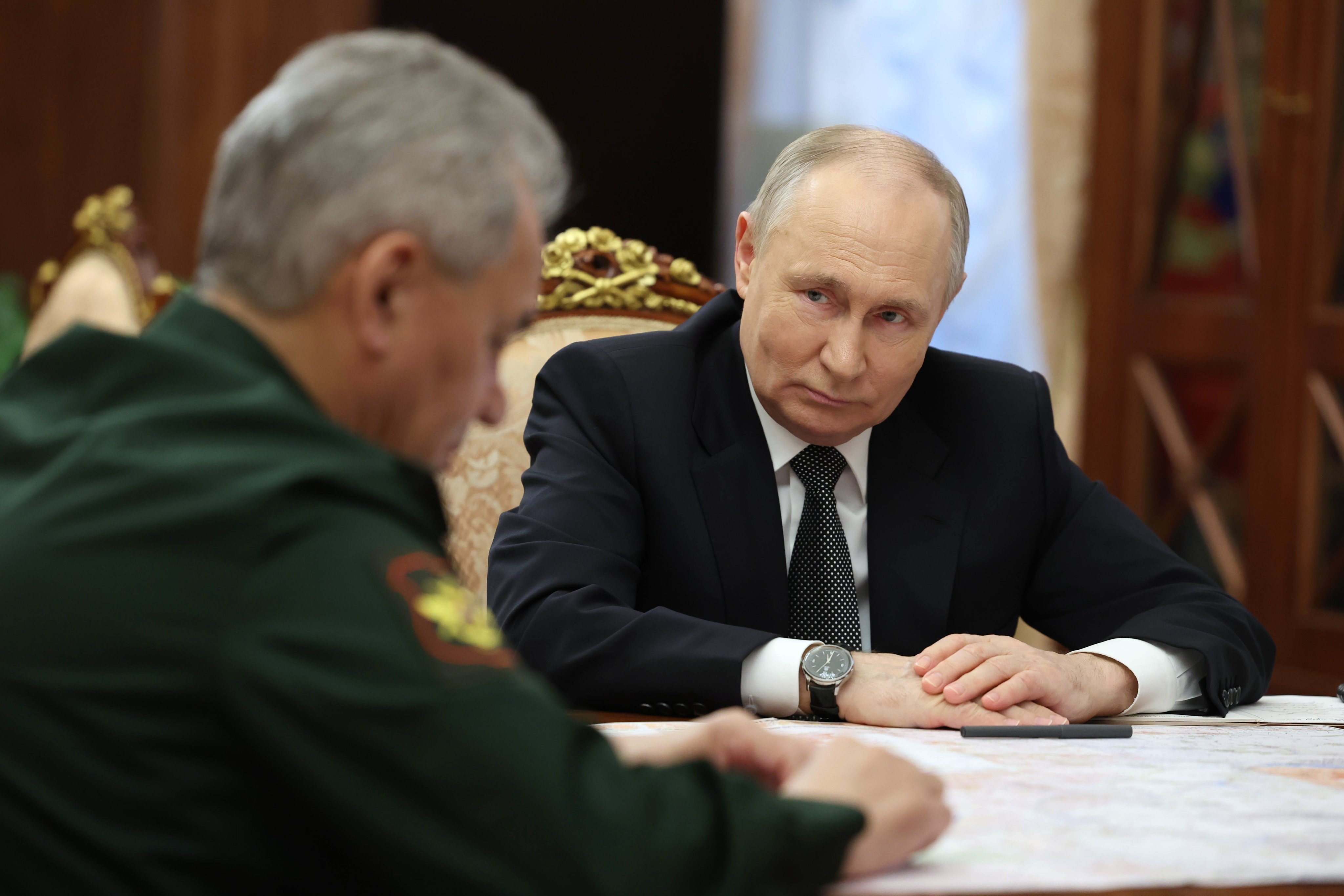 Russian President Vladimir Putin (right) listens to Russian Defence Minister Sergei Shoigu during a meeting at Kremlin on Tuesday. Photo: Sputnik via EPA-EFE