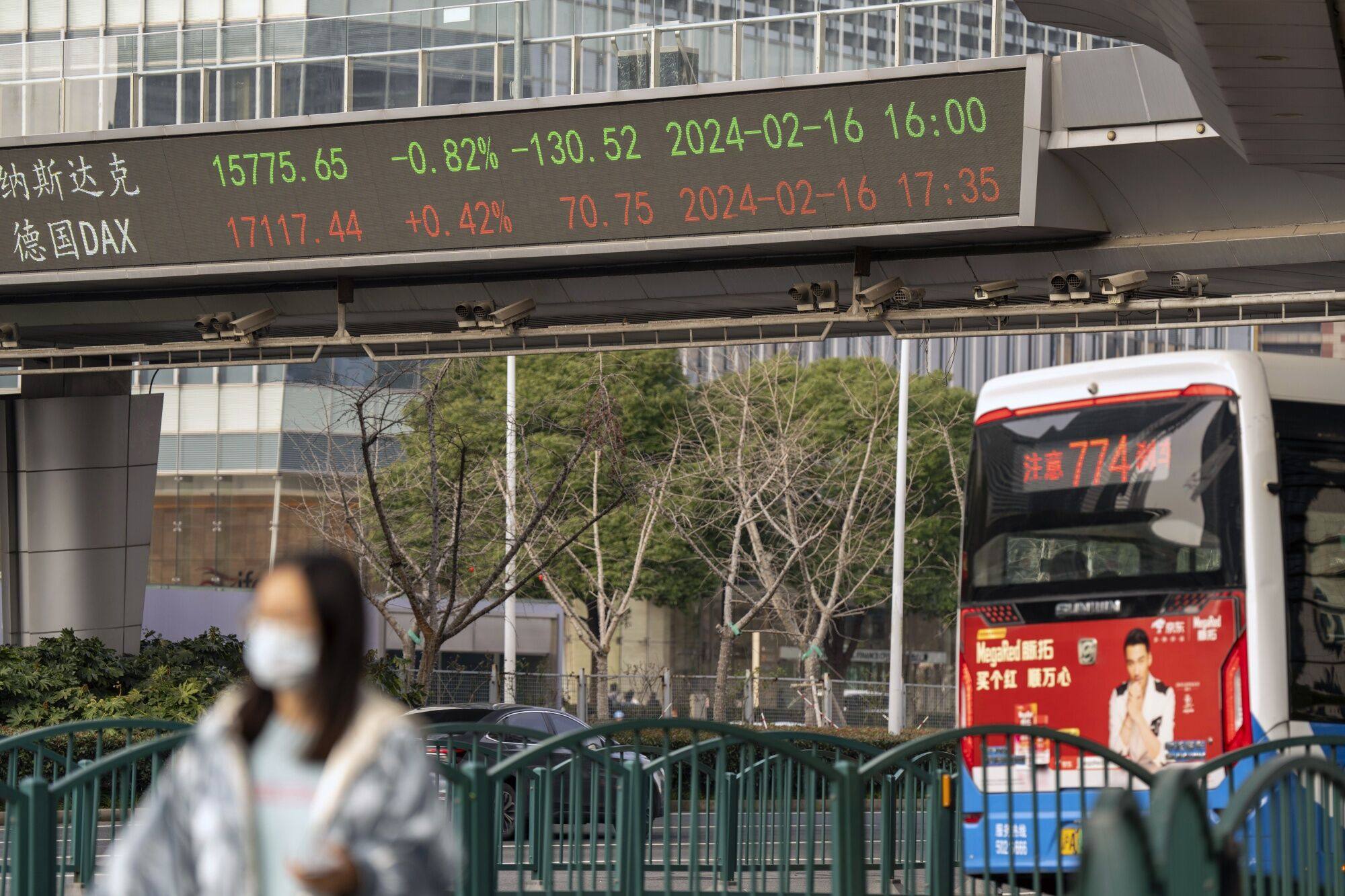 An electronic ticker displays stock figures in Pudong’s Lujiazui Financial District in Shanghai on February 19, 2024. Photo: Bloomberg