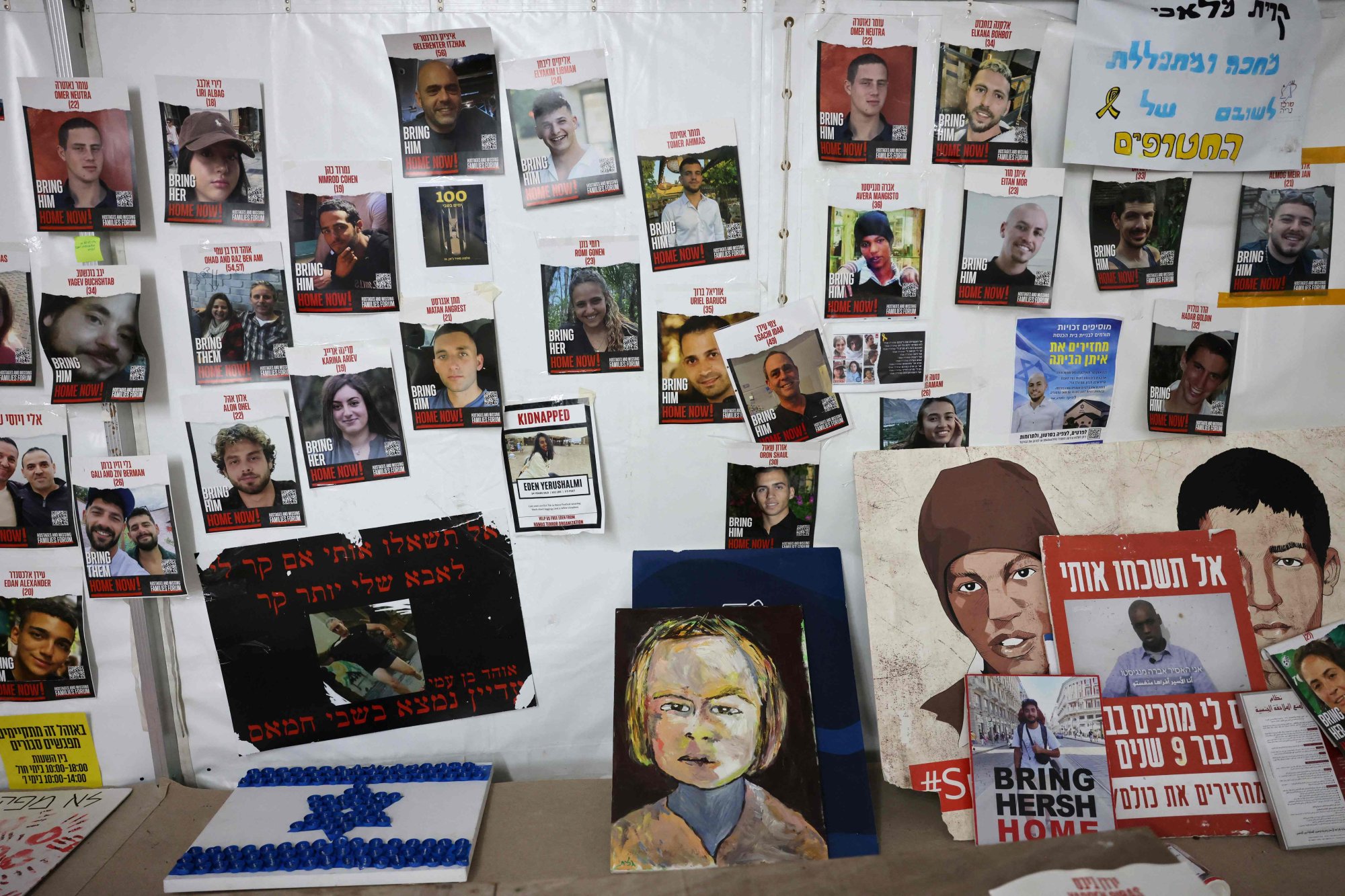 Portraits of Israeli hostages on a wall in Tel Aviv, Israel. Photo; AFP