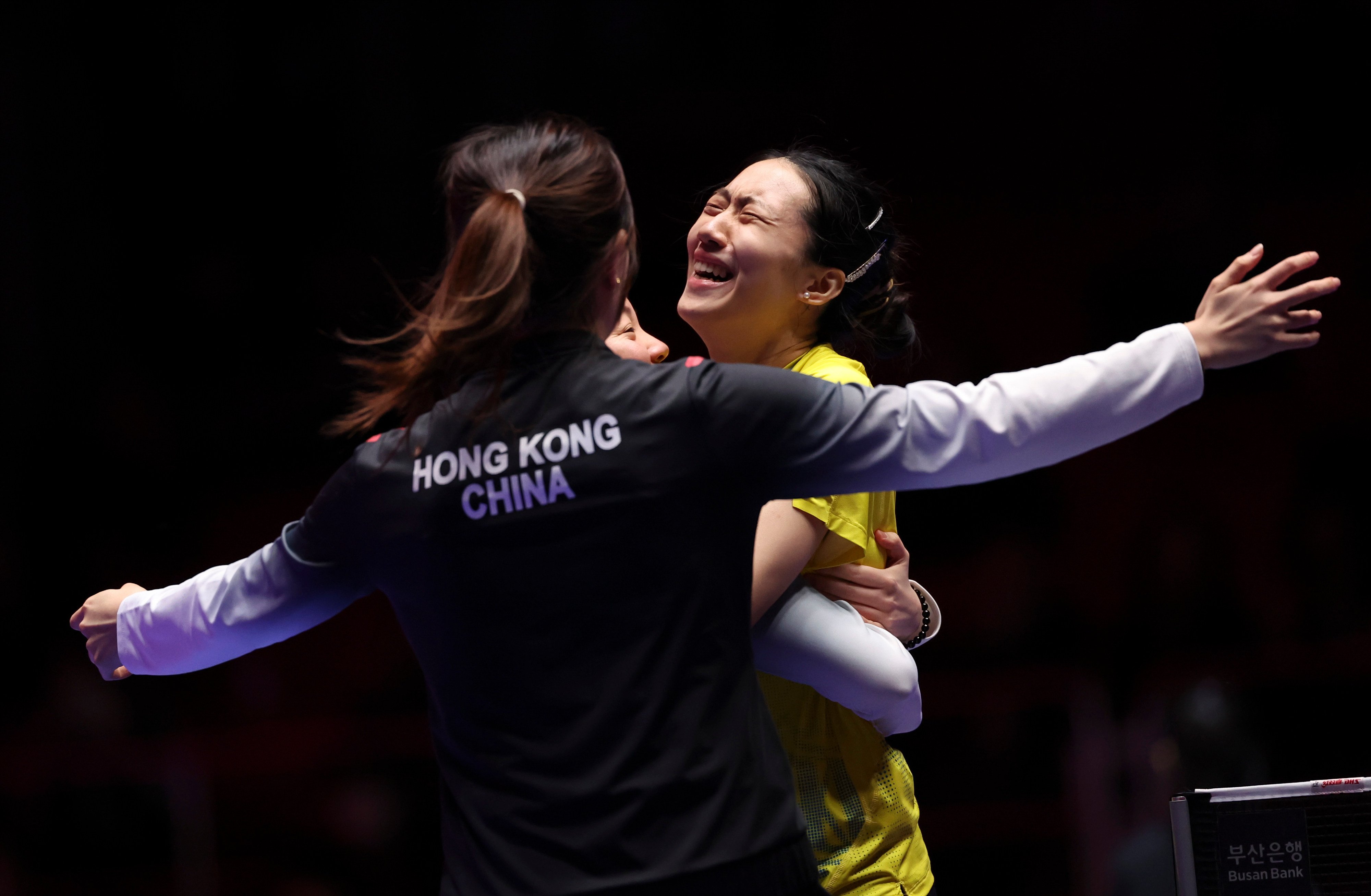 Zhu Chengzhu (right) celebrates with Hong Kong teammates after winning the deciding match against Chinese Taipei in Busan. Photo: Xinhua