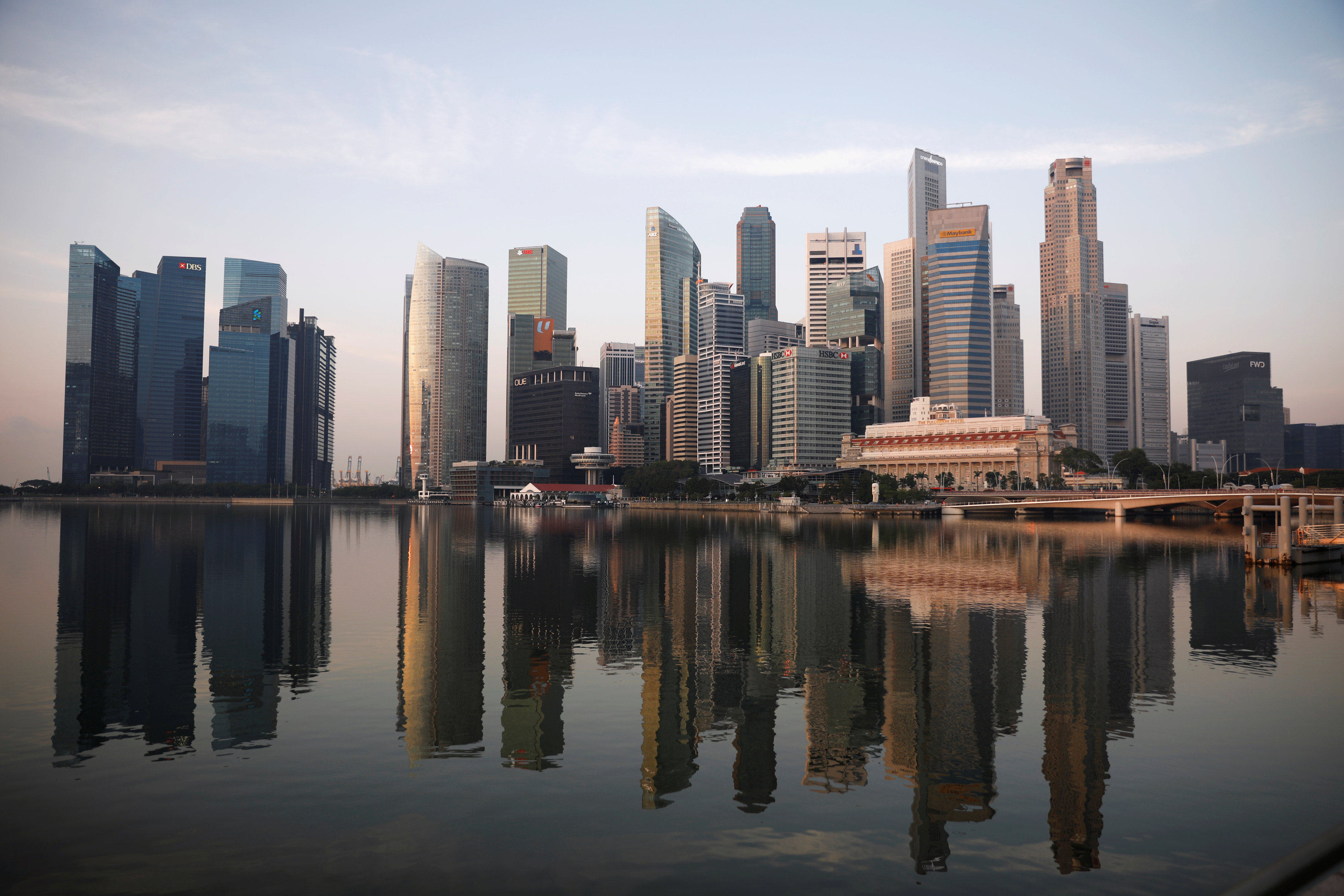 According to a report, Singapore’s diversified economy could help it attract even more global business than Hong Kong for the next five years. Photo: Reuters