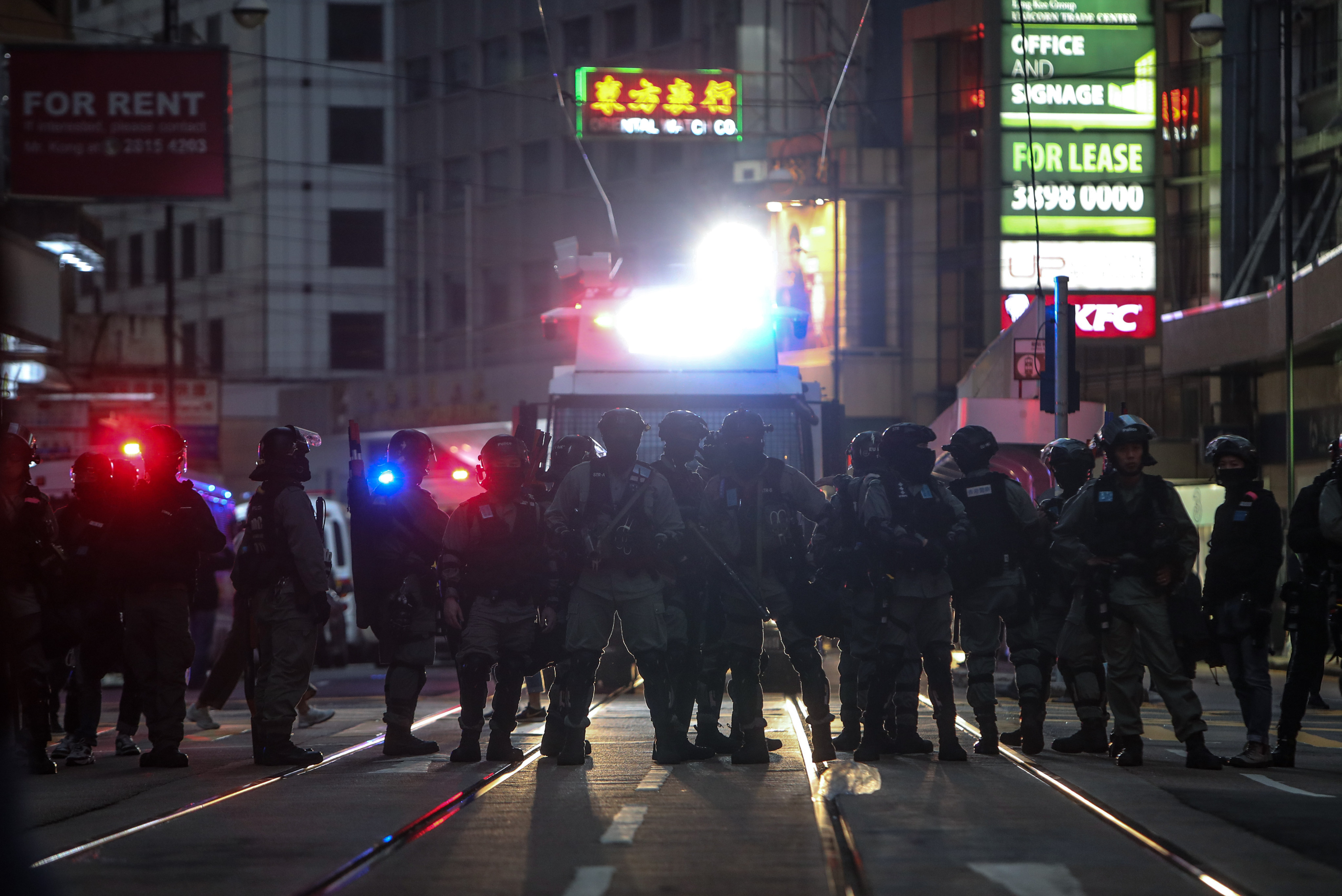 Riot police stand guard on Des Voeux Road Central in Central on December 8, 2019, the night the duo were arrested over their planned attack. Photo: Winson Wong