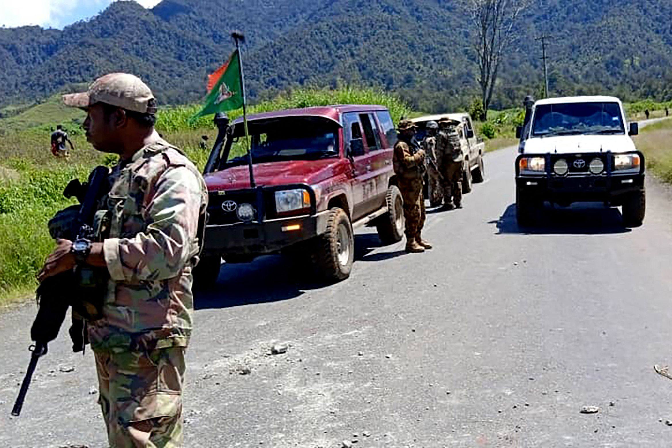 Officers patrol near the town of Wabag in Papua New Guinea’s highlands, where dozens of bodies were found after gun battles between rival tribes. Photo: Royal Papua New Guinea Constabulary / Handout via AFP
