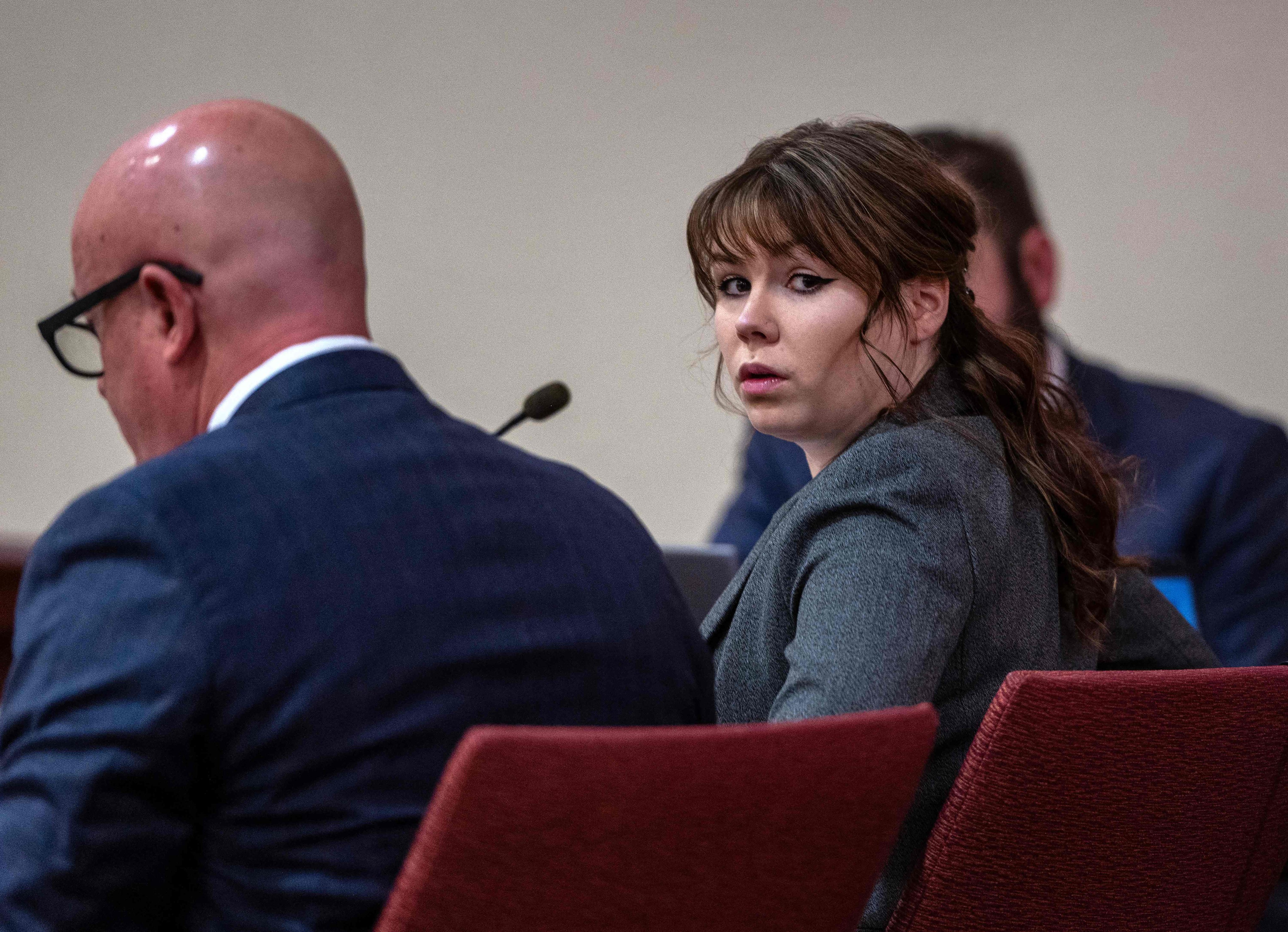 Armorer Hannah Gutierrez-Reed sits in court with her lawyer Jason Bowles in Santa Fe, New Mexico, on  Thursday. Photo: AFP
