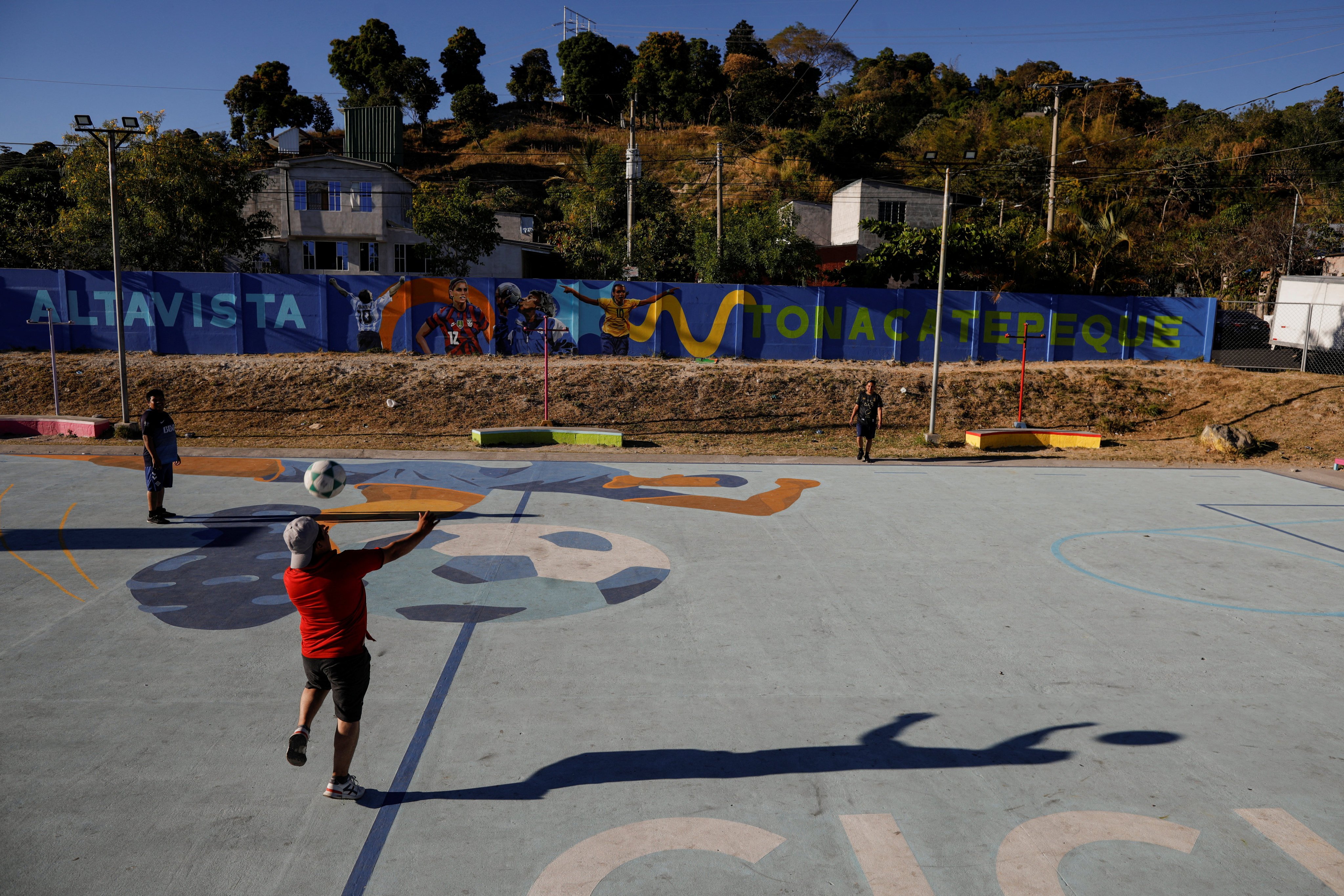 Men play soccer in a renovated park 
that sprang from a project executed by the US Agency for International Development in Tonacatepeque, El Salvador, in January. Photo: Reuters