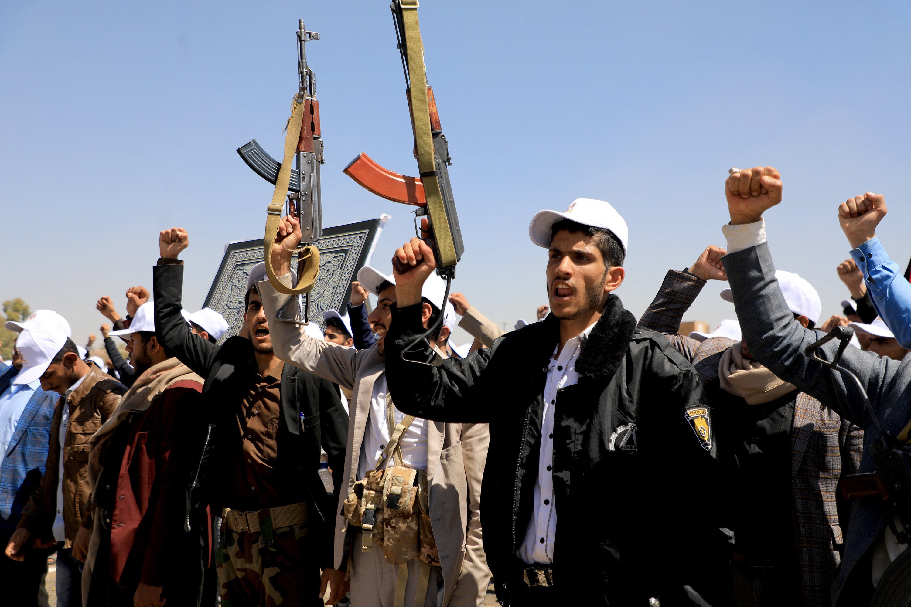 Students recruited into the ranks of Yemen’s Houthi rebels hold up rifles as they shout slogans in support of the Palestinians and against the US, Britain and Israel during a rally in Sanaa on Wednesday. Photo: TNS