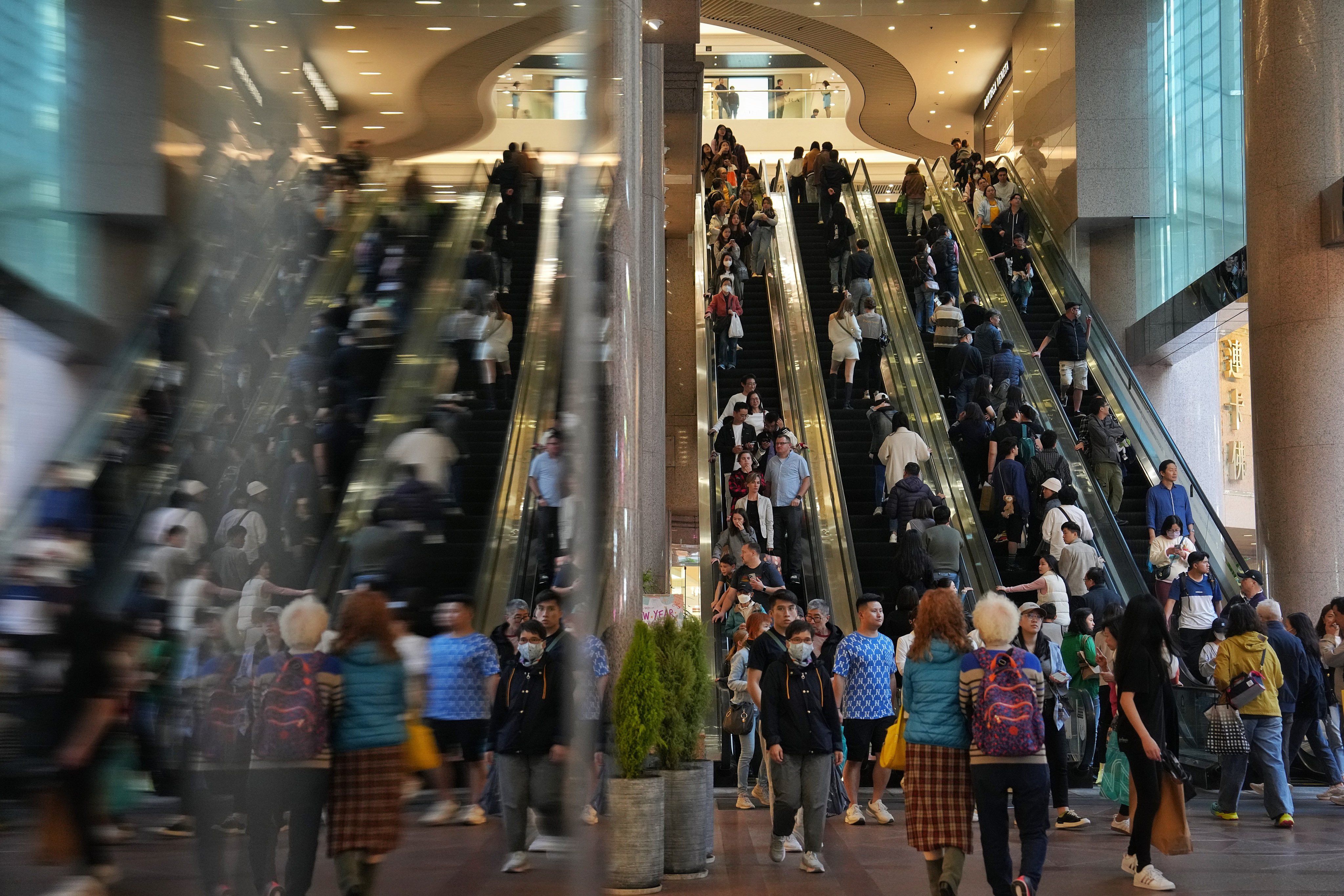 People enter a shopoping mall in Causeway Bay on January 1. A goods and services tax could provide Hong Kong with much-needed revenue. Photo: Elson LI