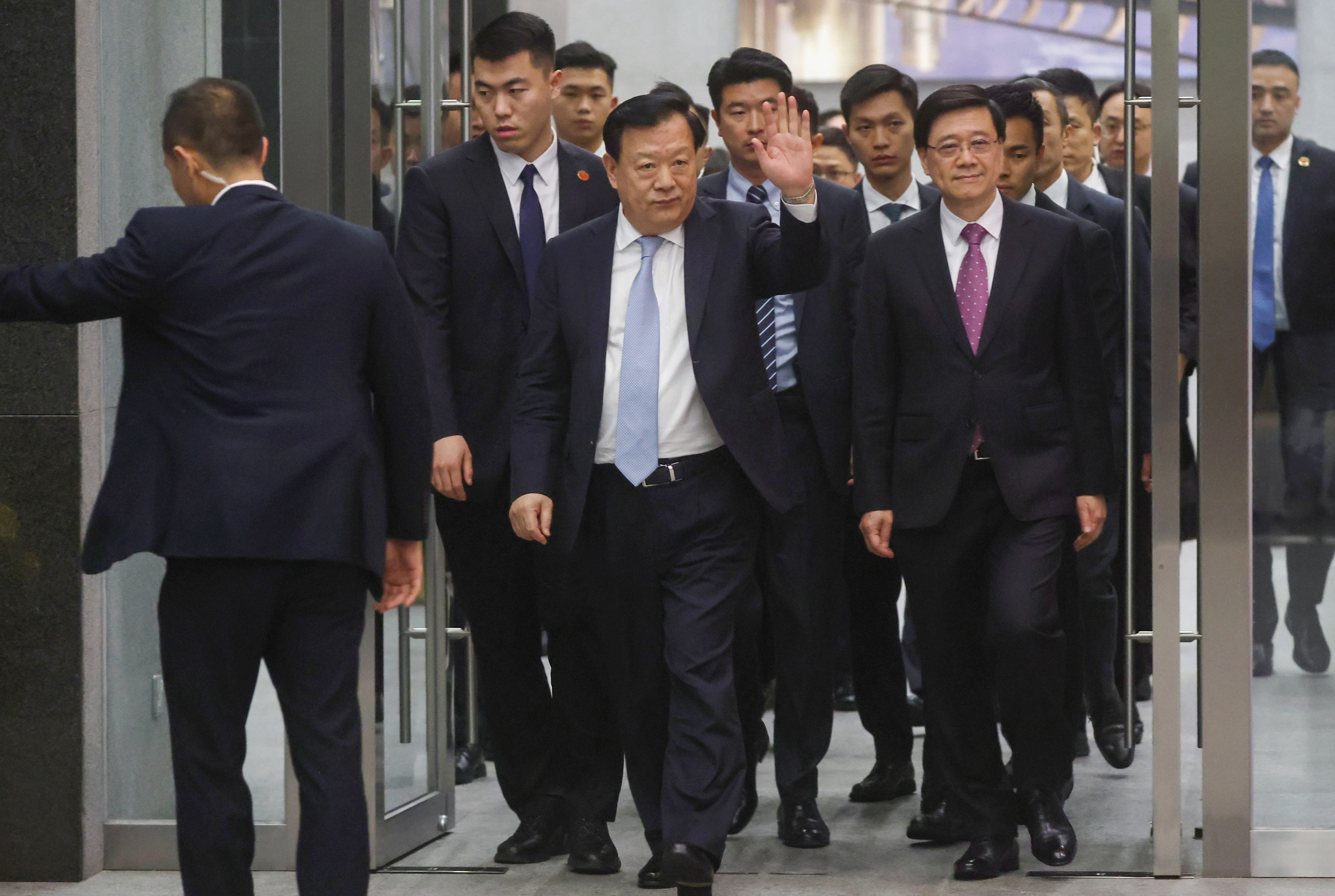 Xia Baolong waves as he leaves government headquarters on Friday. Photo: Edmond So