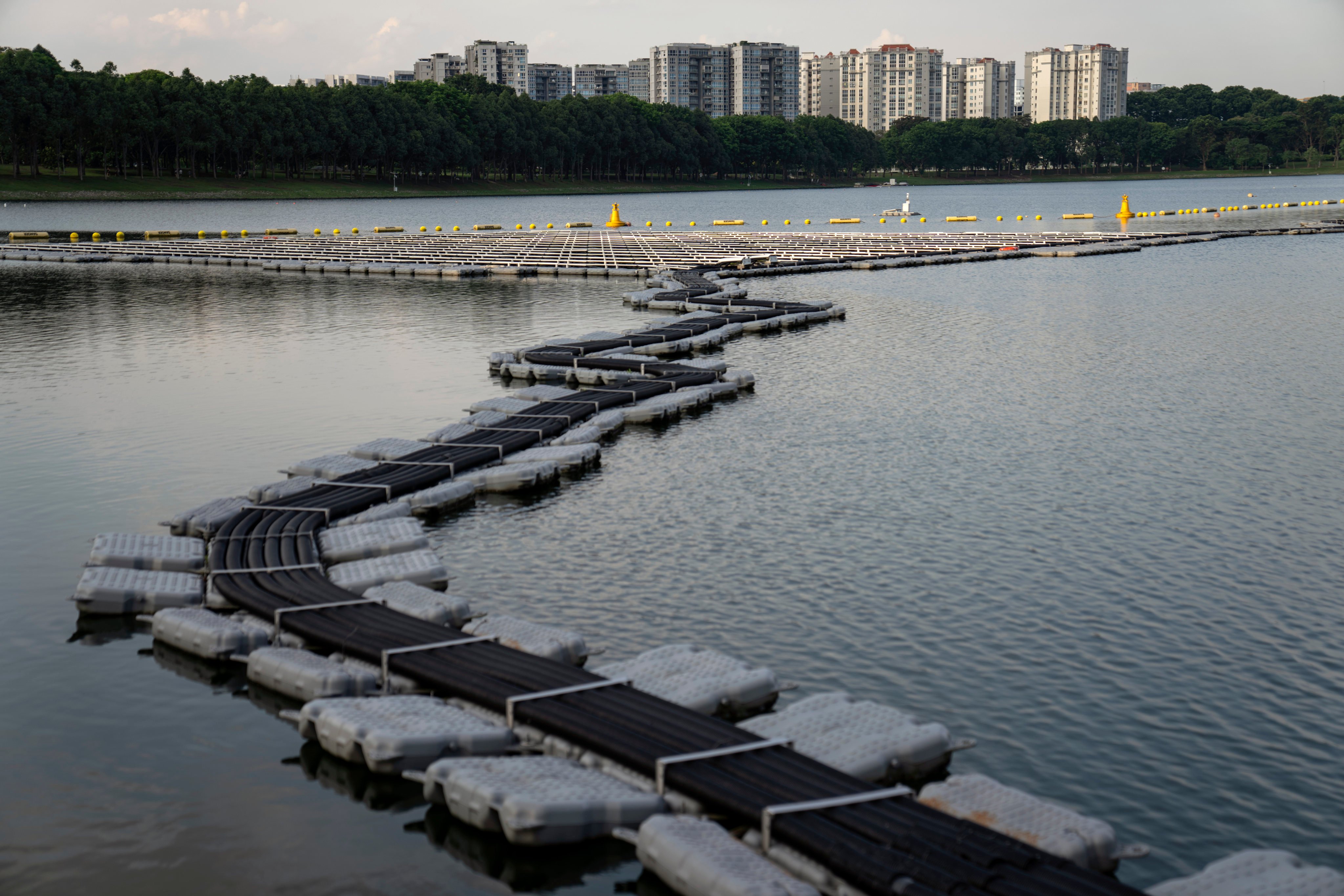 Cables run out to a floating solar panel farm in Singapore, one of the world’s most densely populated countries. Water consumption has increased by over twelve times since the nation’s independence from Malaysia in 1965. File photo: AP