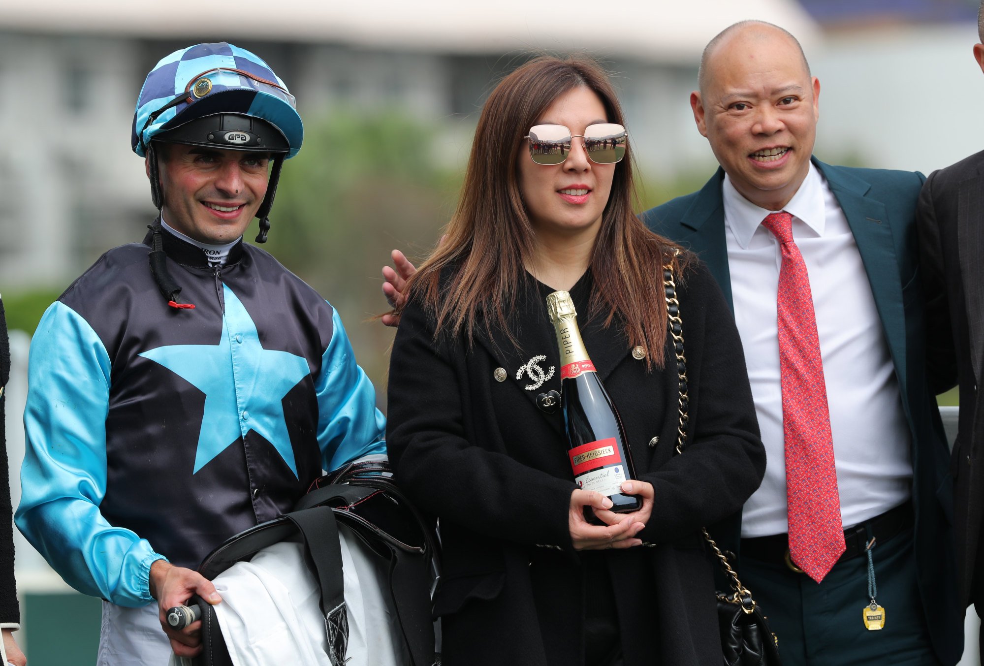 Jockey Andrea Atzeni and trainer Chris So after Super Sunny Sing wins at Sha Tin.