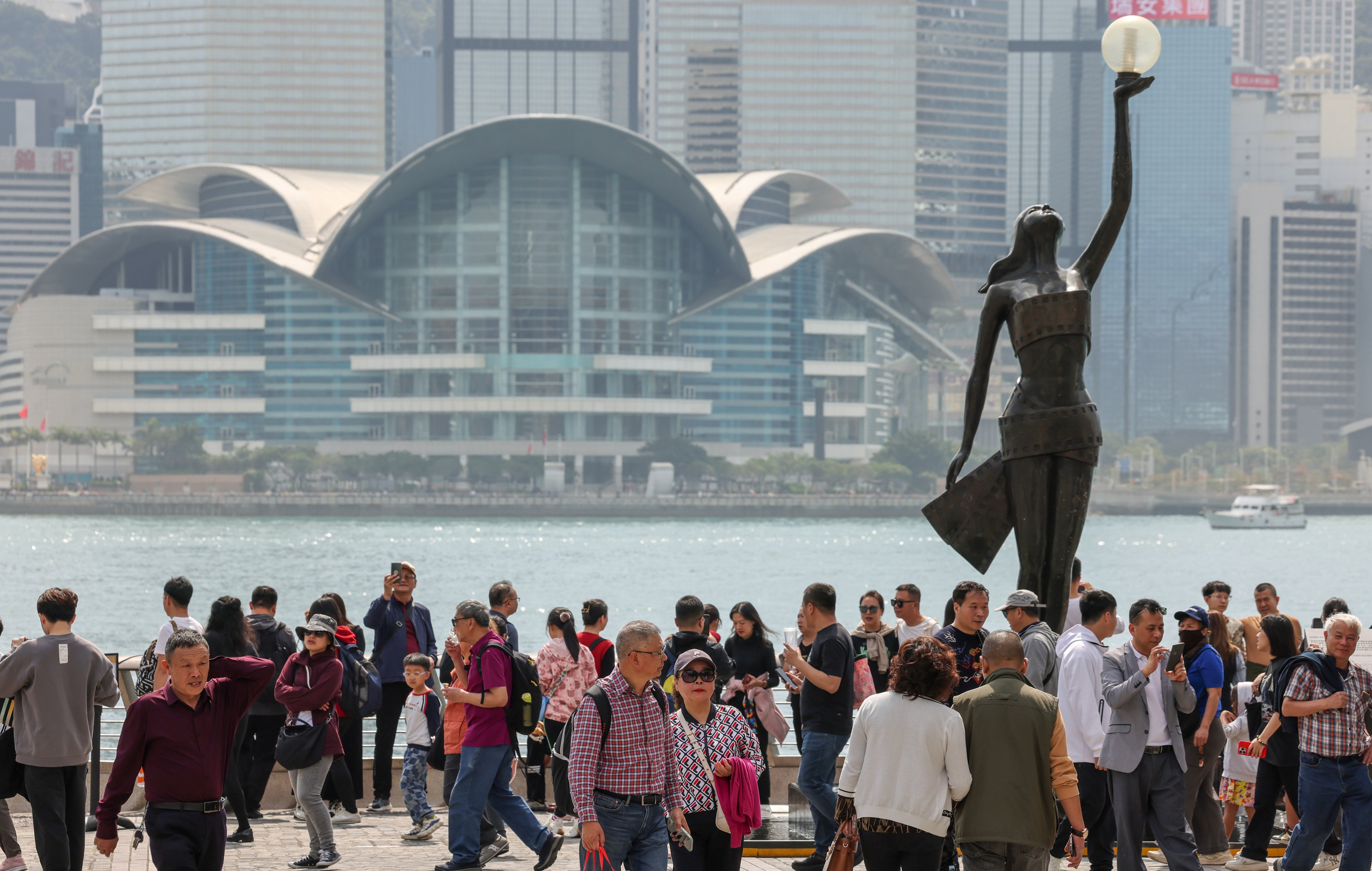 Visitors at the Avenue of Stars in Tsim Sha Tsui. The solo traveller scheme was introduced in 2003 to help the economy after the Sars epidemic. Photo: Jelly Tse