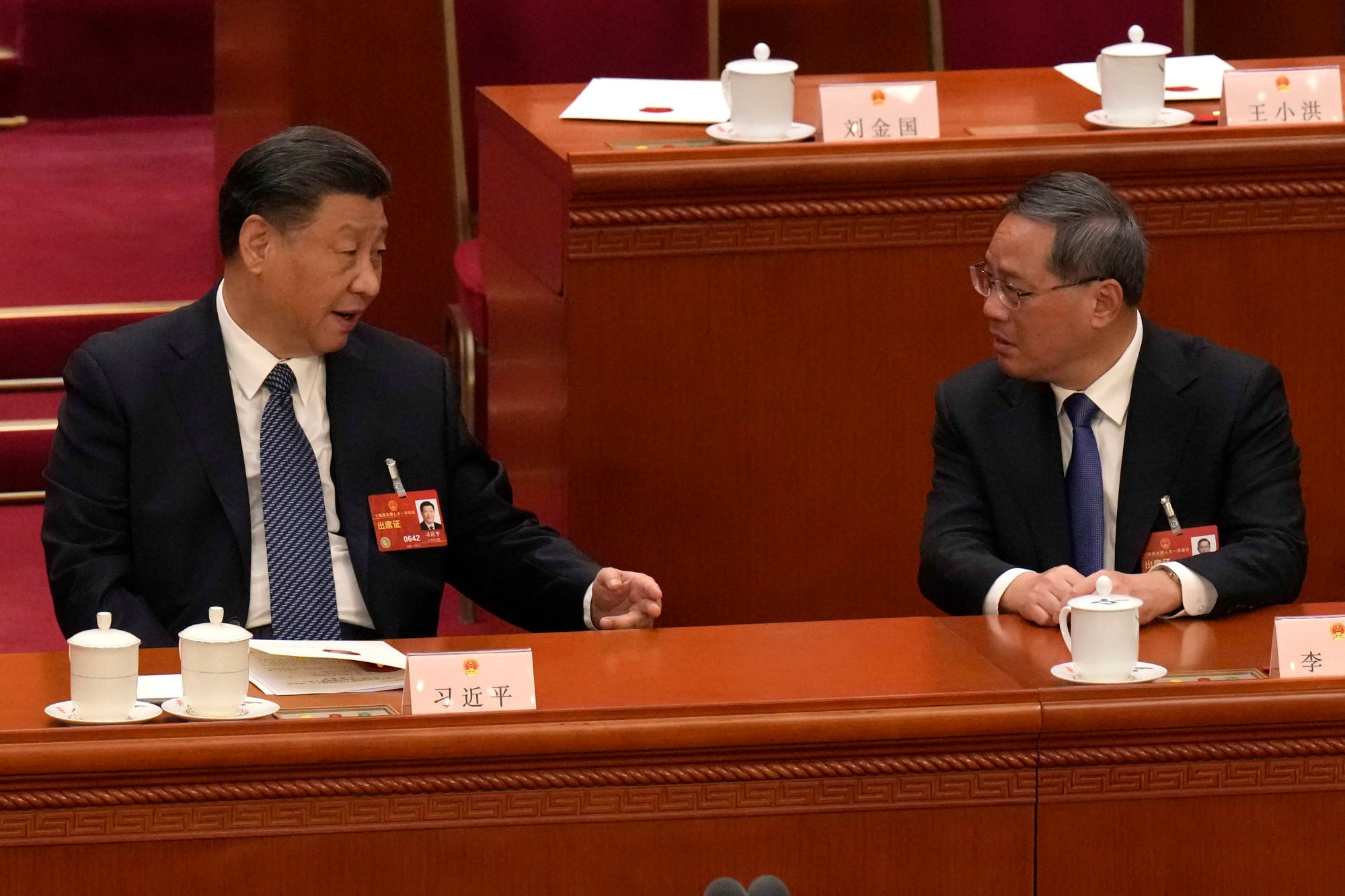 Chinese President Xi Jinping (left) confers with Premier Li Qiang during a session of China’s National People’s Congress last year. Photo: AP