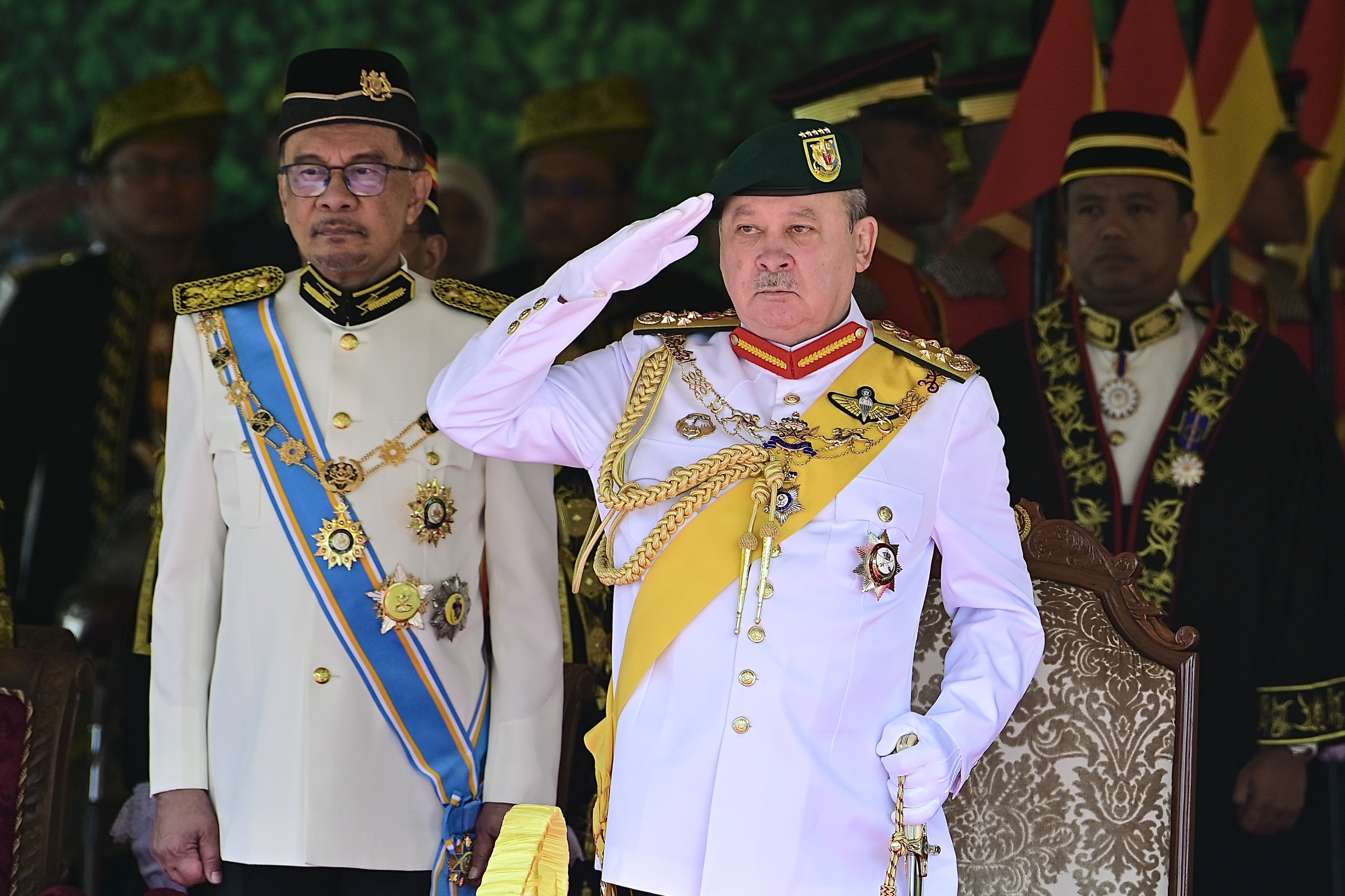 Malaysia’s king Sultan Ibrahim Sultan Iskandar (right) saluting as Malaysian PM Anwar Ibrahim (left) looks on during the opening of the third session of the 15th Parliament in Kuala Lumpur on February 26. Photo: EPA-EFE