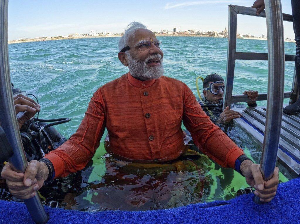 India’s Prime Minister Narendra Modi emerges from the sea earlier this month after praying at an underwater site in Dwarka, Gujarat, claimed to be a lost mythical city associated with Hindu god Lord Krishna. Photo: Narendra Modi on X via AP