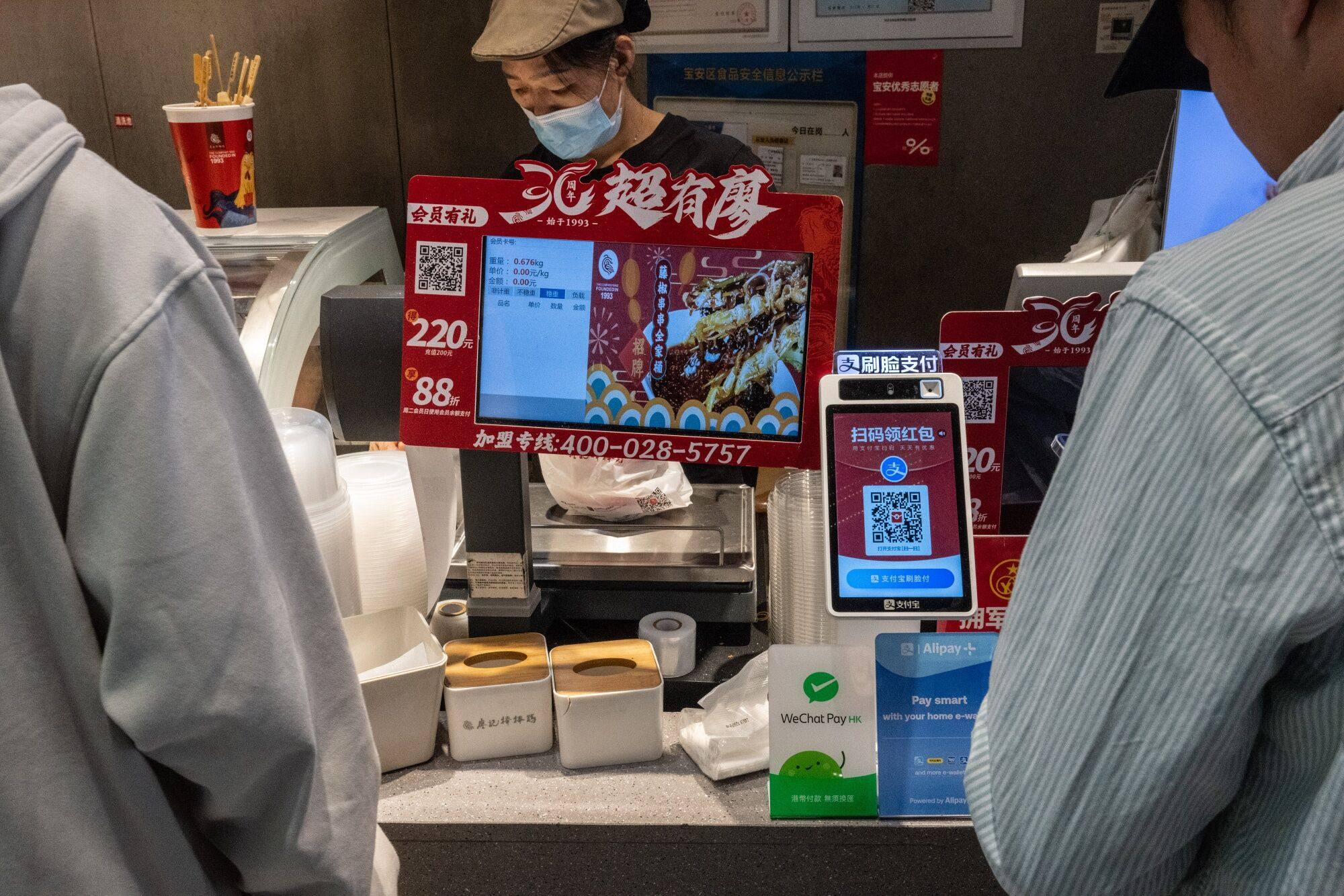 QR codes for various digital payment services at a food store in Shenzhen, China. Photo: Bloomberg