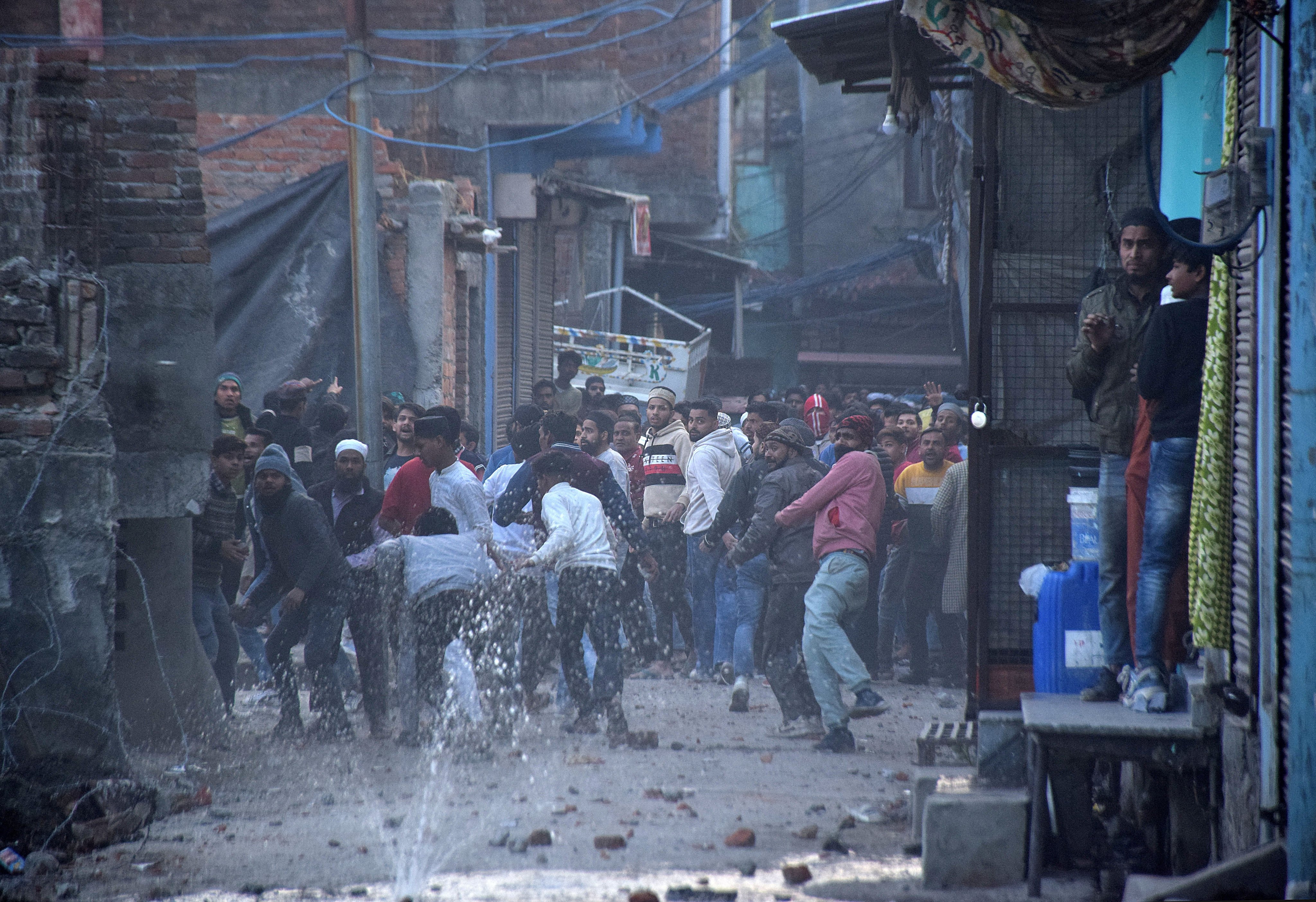Demonstrators throw stones towards police during a protest against a government demolition drive in Haldwani, in the northern Indian state of Uttarakhand, on February 8. Photo: Reuters