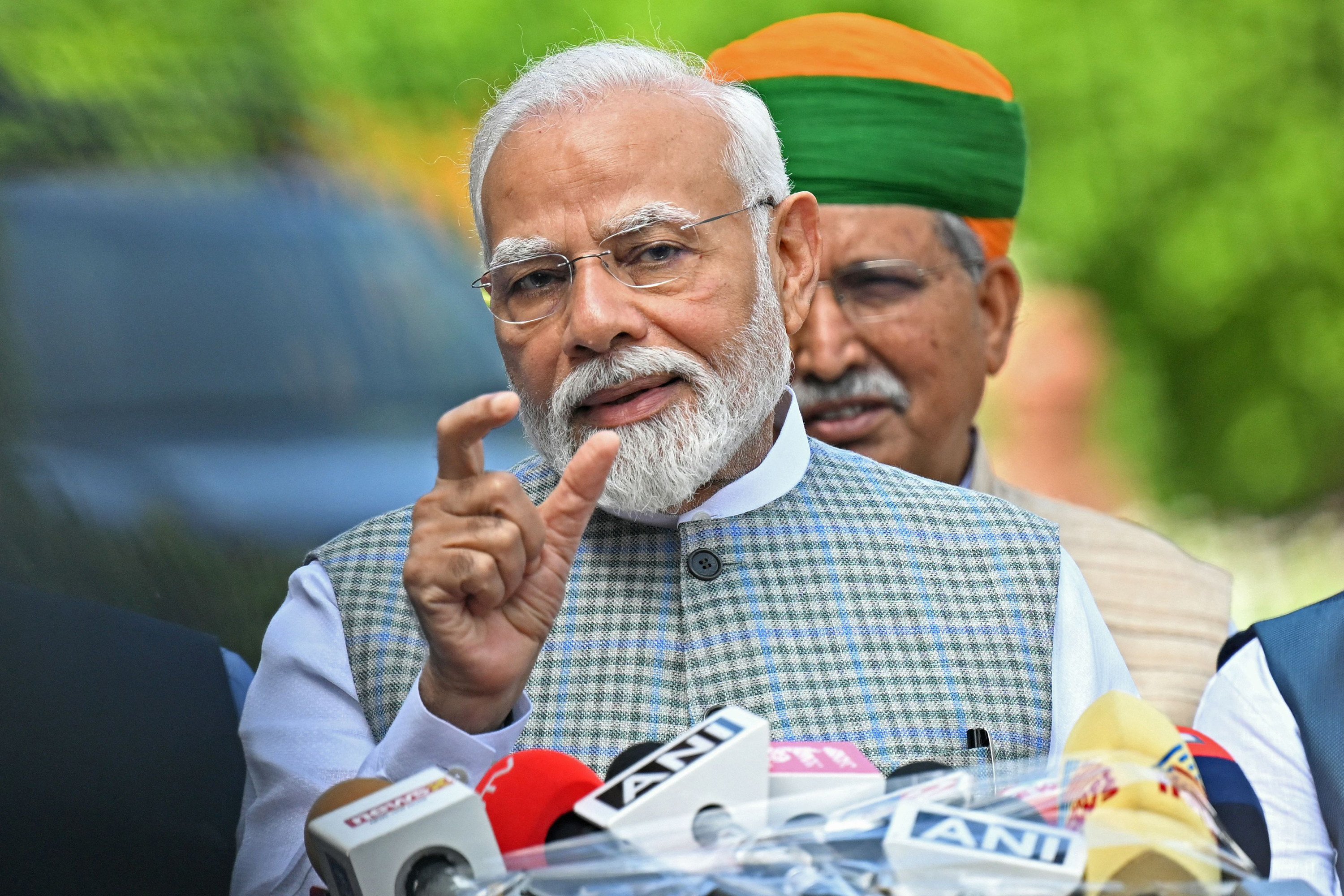 India’s Prime Minister Narendra Modi addresses reporters after arriving to attend parliament in New Delhi in September 2023. Photo: TNS